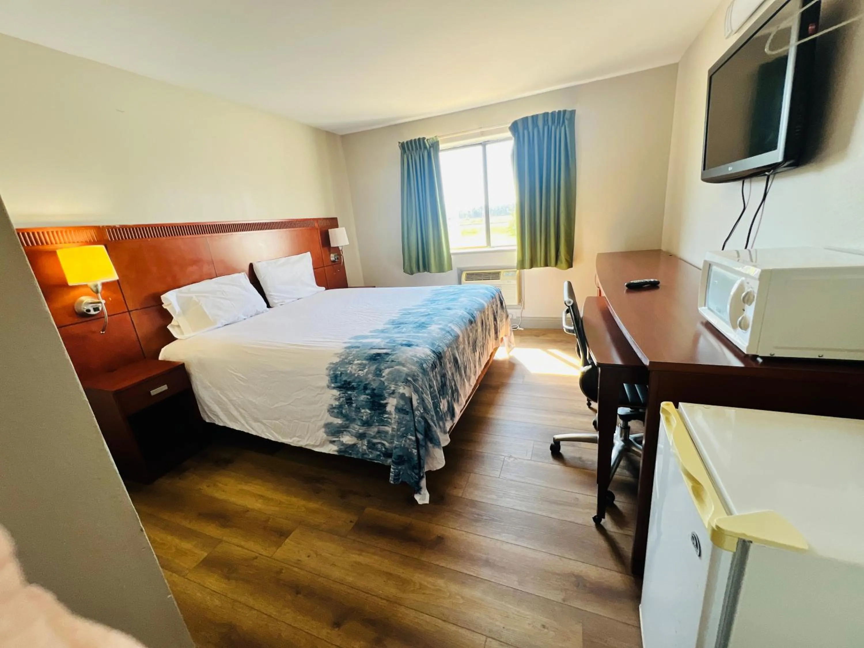 Bedroom in Rosewood Inn By OYO Union City I-69