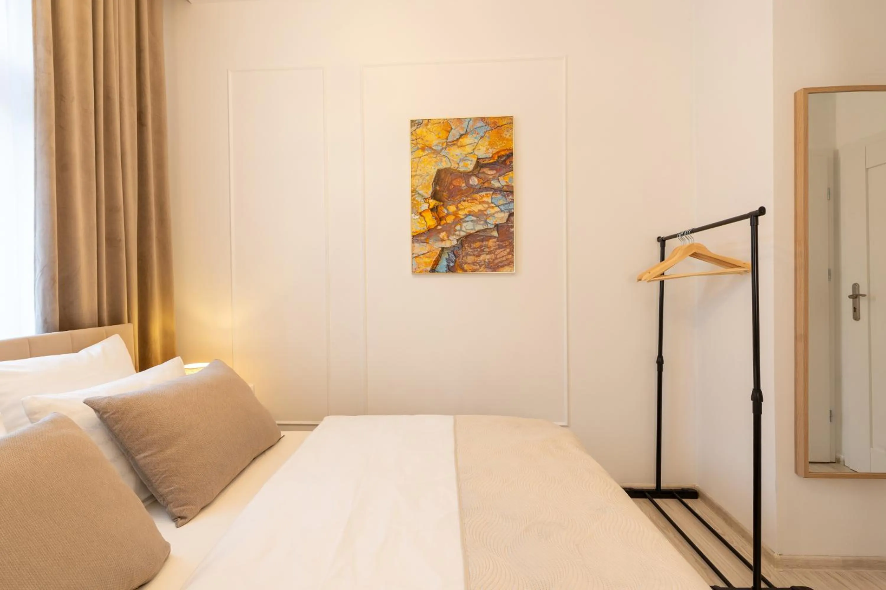 Decorative detail, Bed in Kazimierz Residence Apartments by Staymoovers