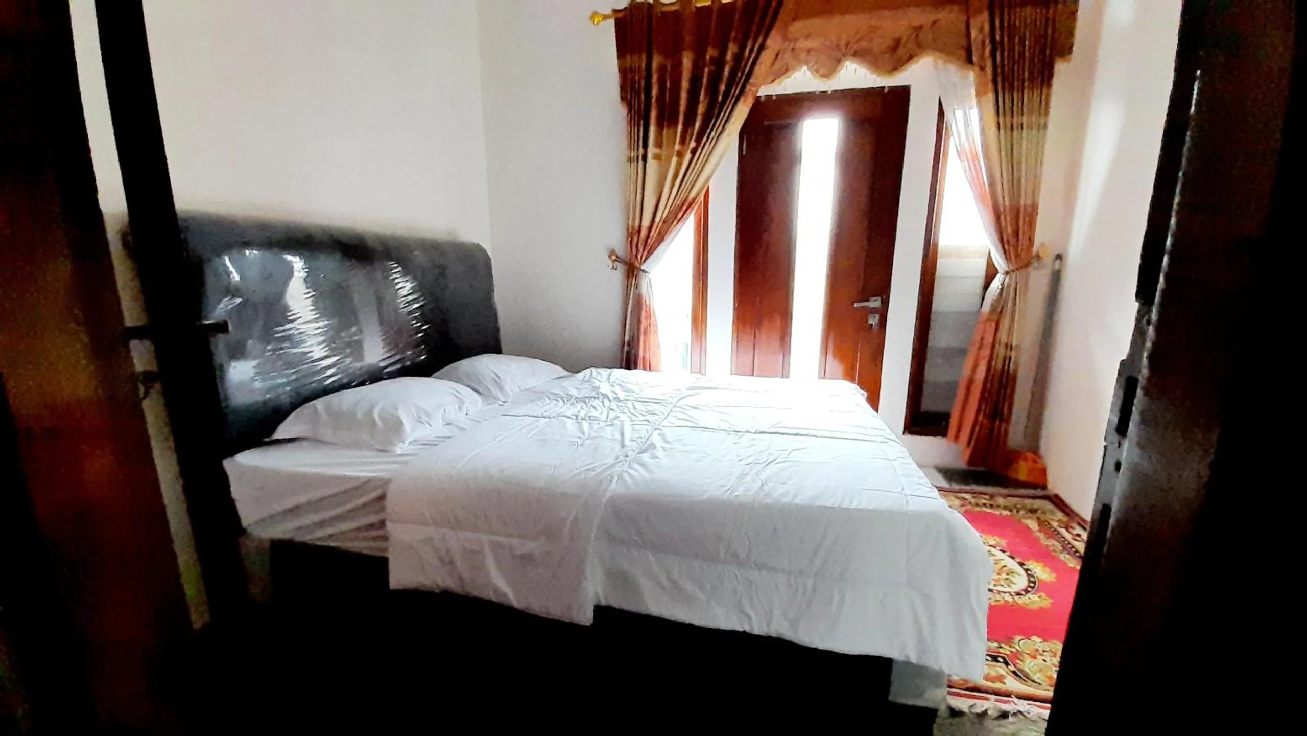 Bed in Homestay Merpati Dieng Syariah RedPartner