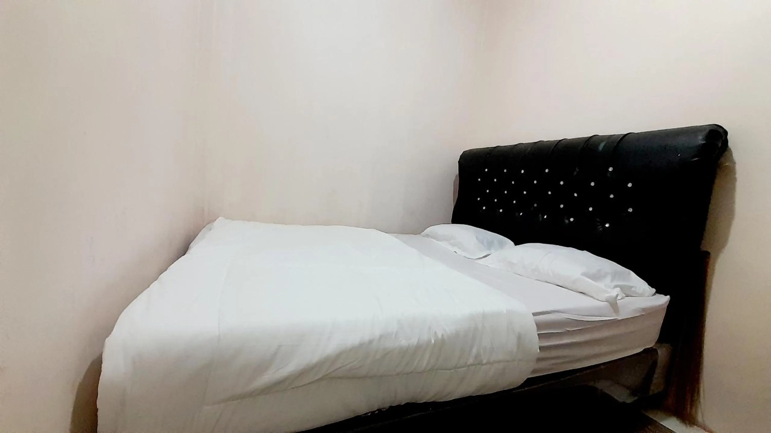 Bed in Homestay Merpati Dieng Syariah RedPartner