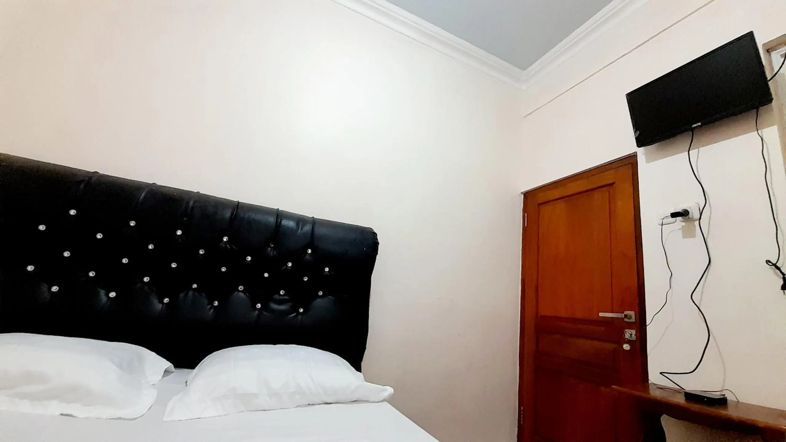 Bed in Homestay Merpati Dieng Syariah RedPartner