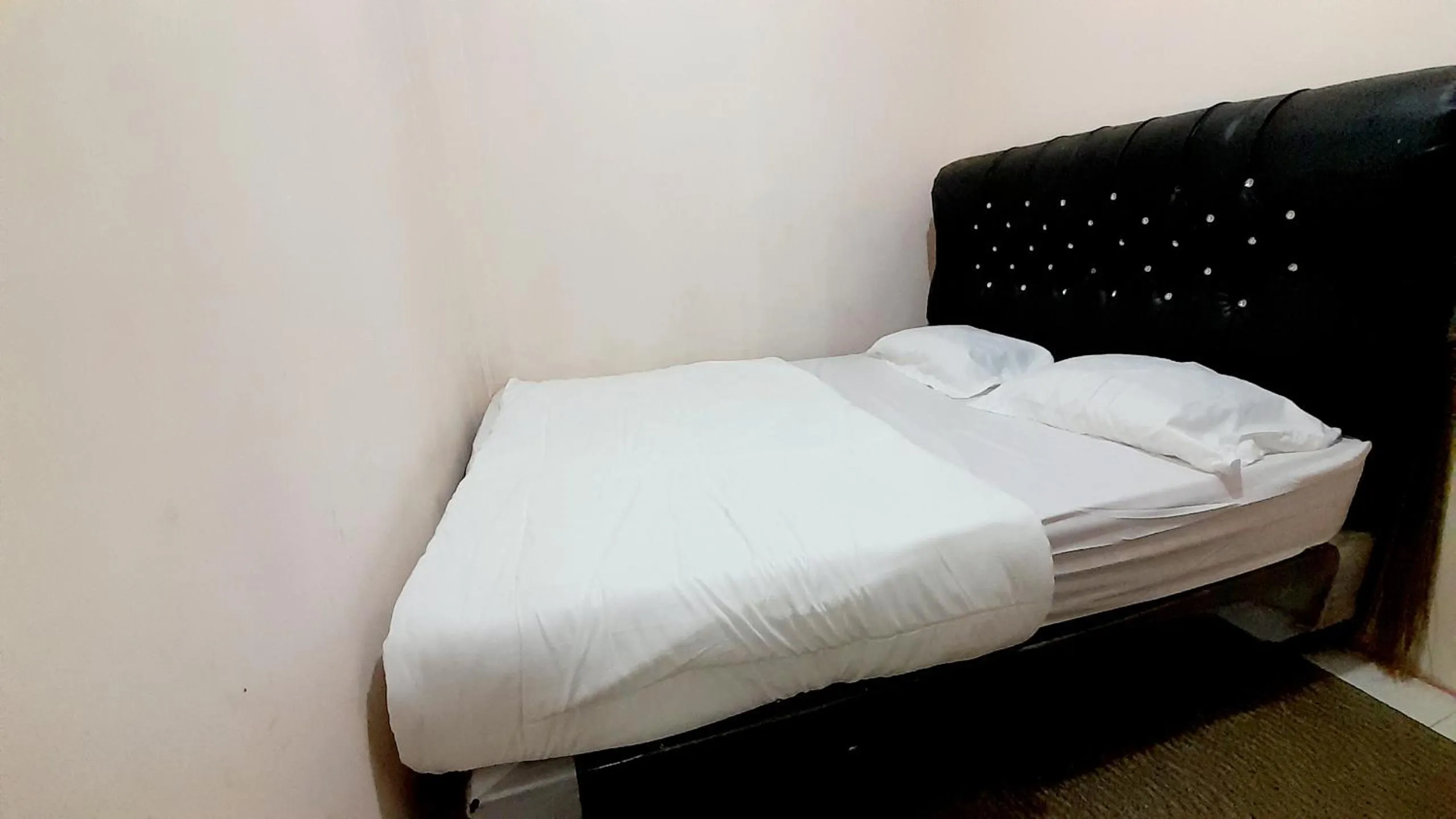 Bed in Homestay Merpati Dieng Syariah RedPartner