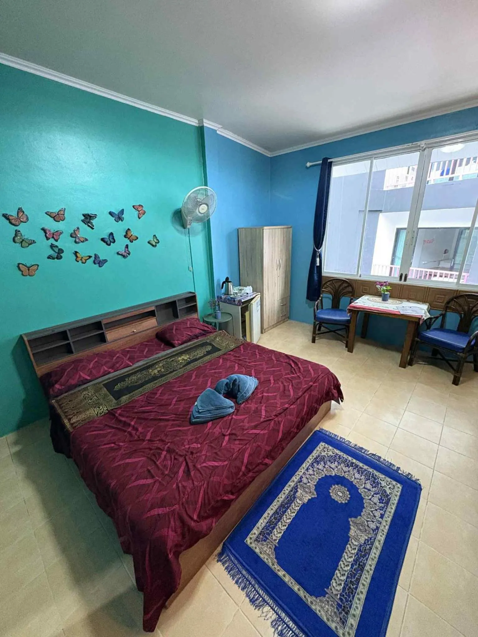 Bed in San Antonio Beach Guesthouse & Restaurant