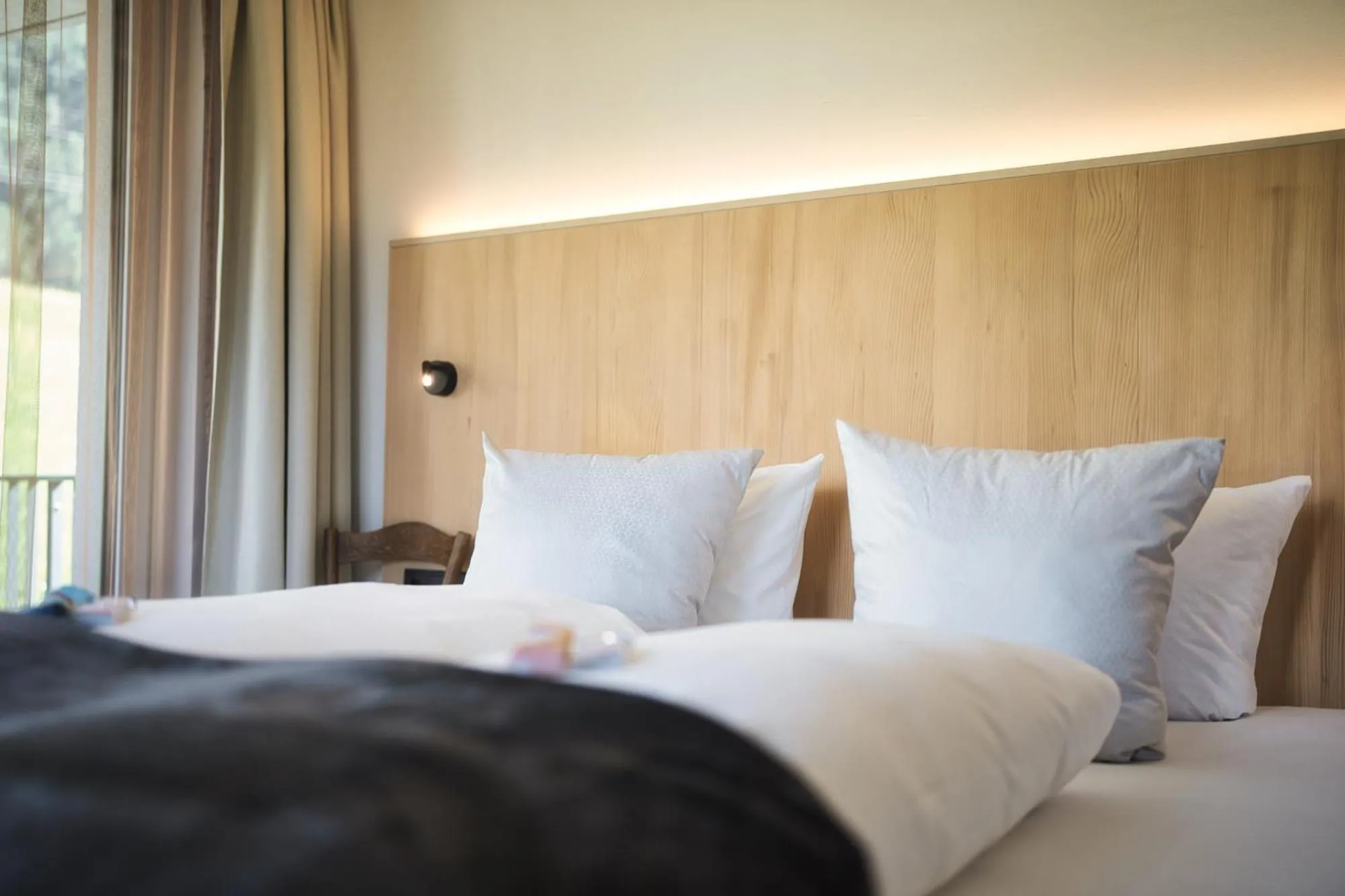 Bed in Hotel Die Arlbergerin - Design & Tiroler Gemütlichkeit