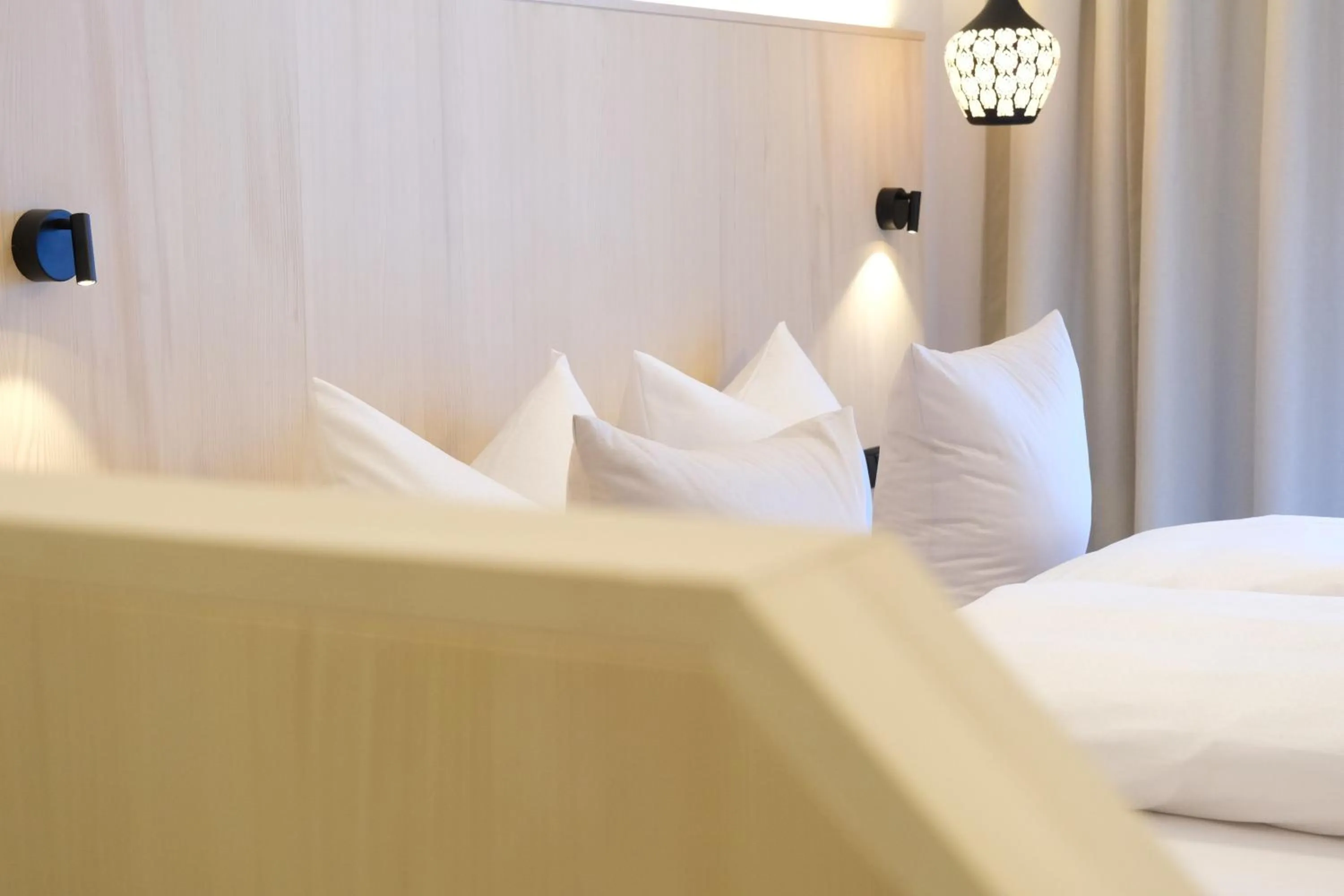 Bed in Hotel Die Arlbergerin - Design & Tiroler Gemütlichkeit
