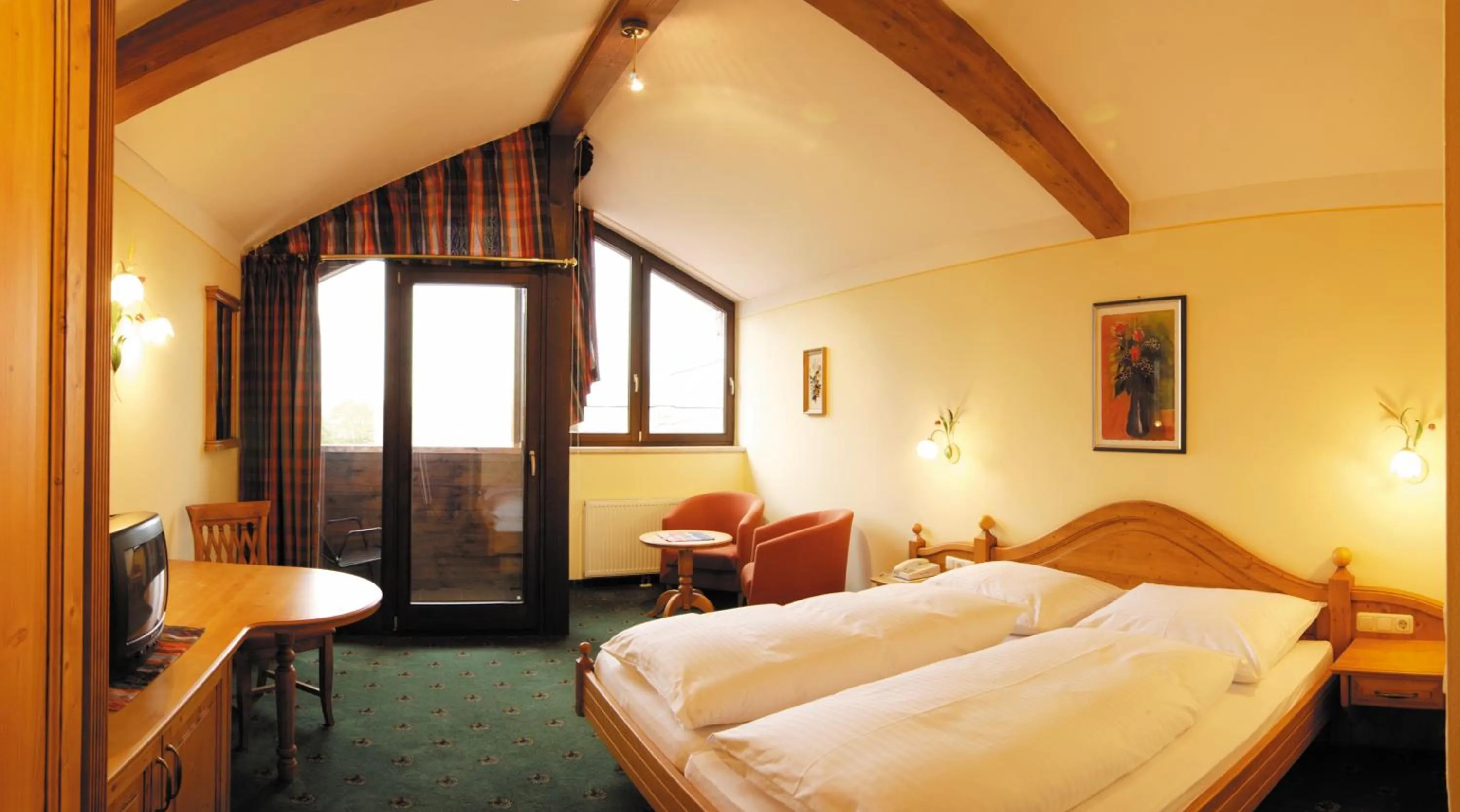 Bed in Hotel Flatscher
