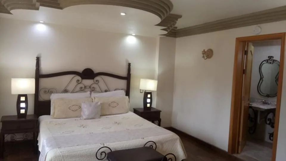 Bed in Hotel Hacienda los Narcisos