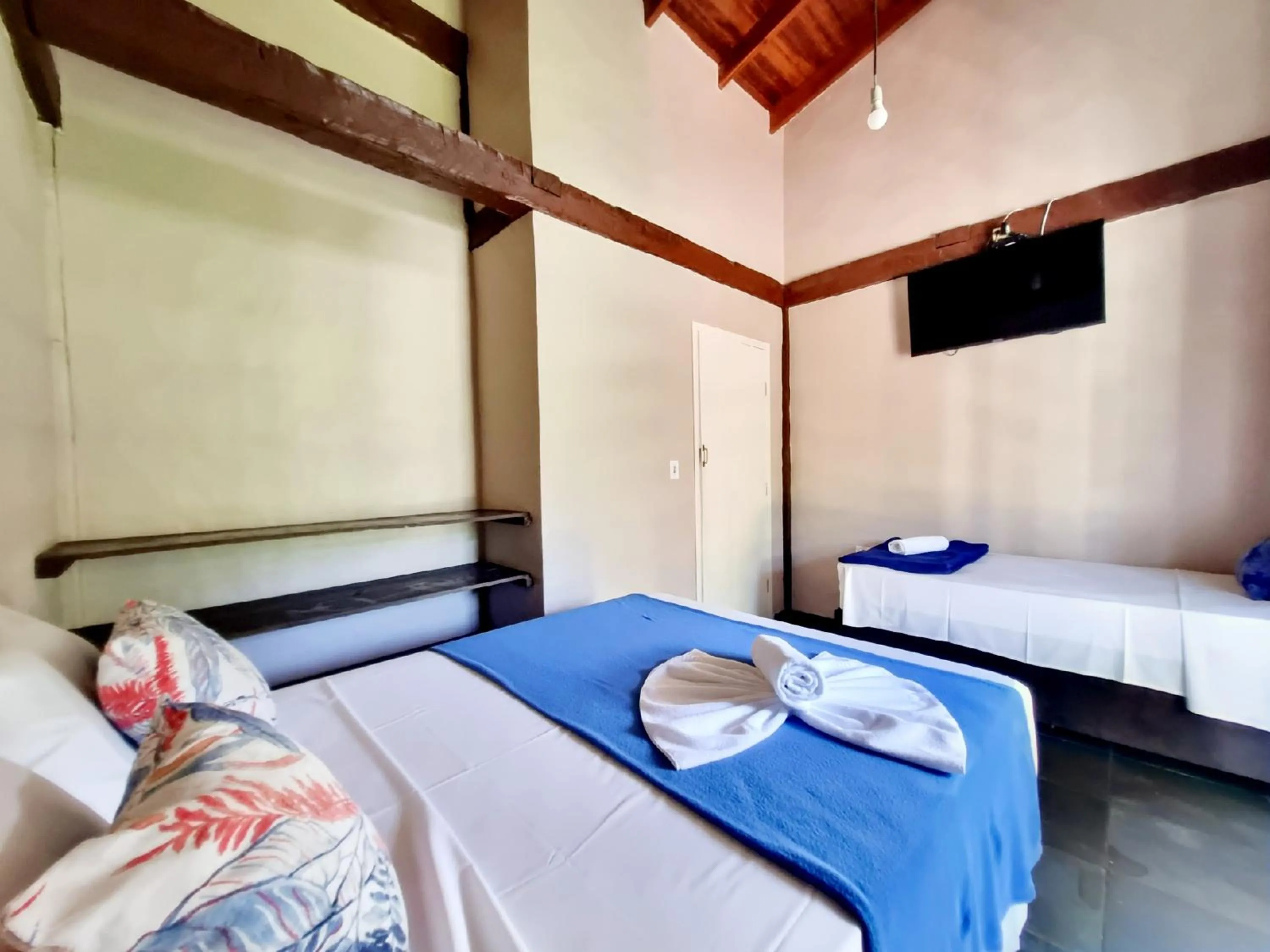 Bed in Pousada Delta Mar Maresias