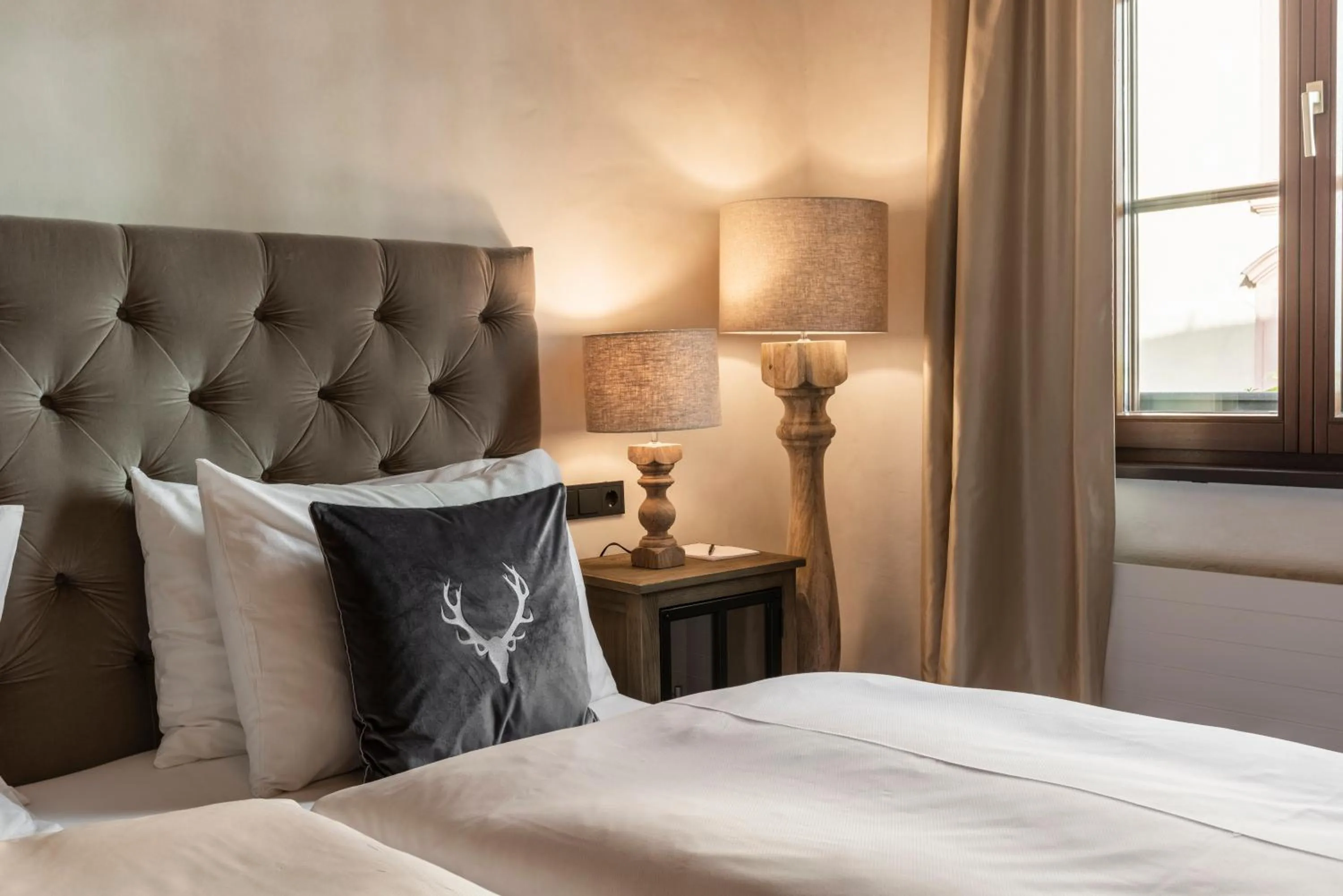 Bed in Boutiquehotel Weisses Rössl