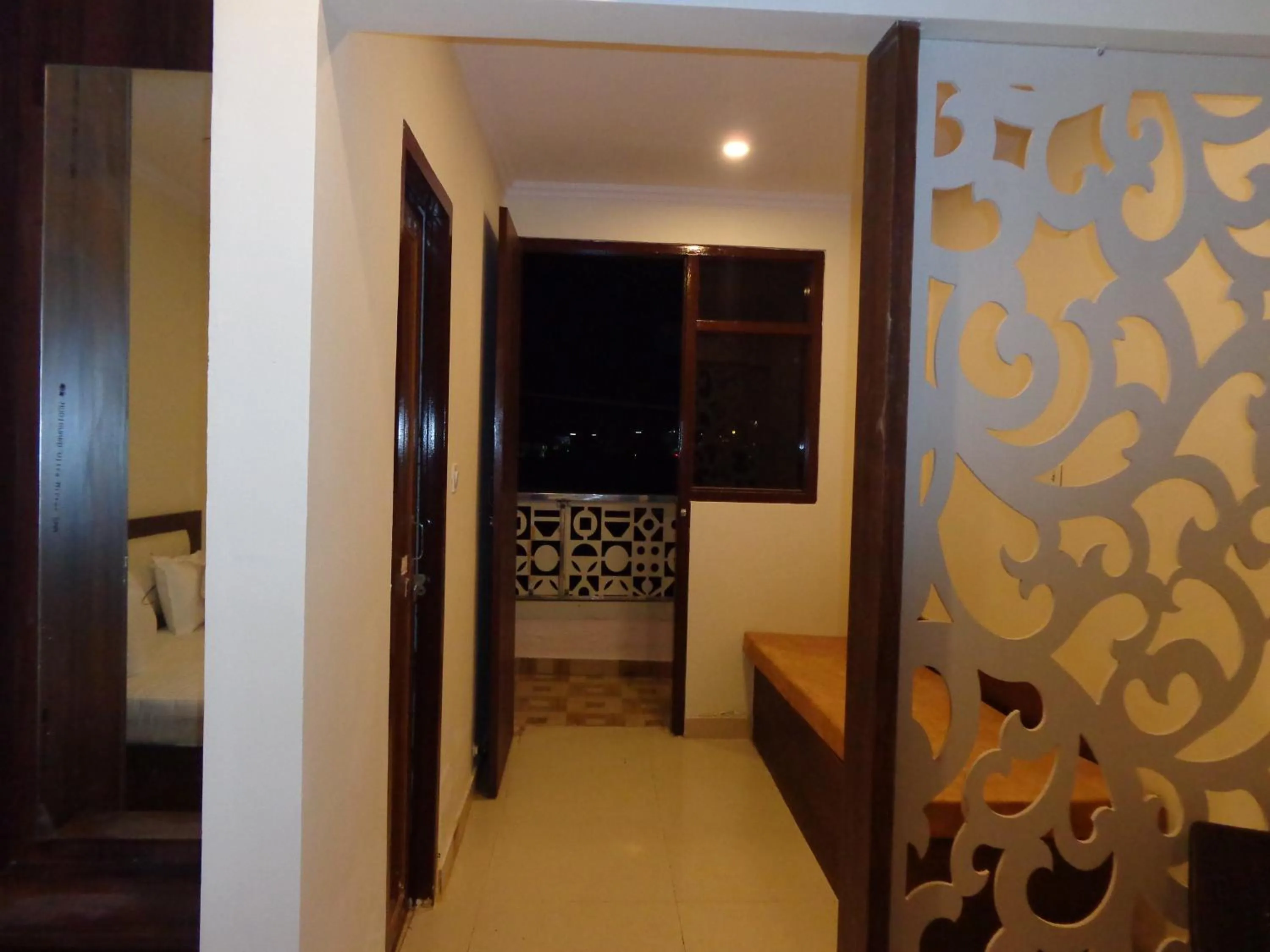 Communal lounge/ TV room, Bed in Rukmani Inn