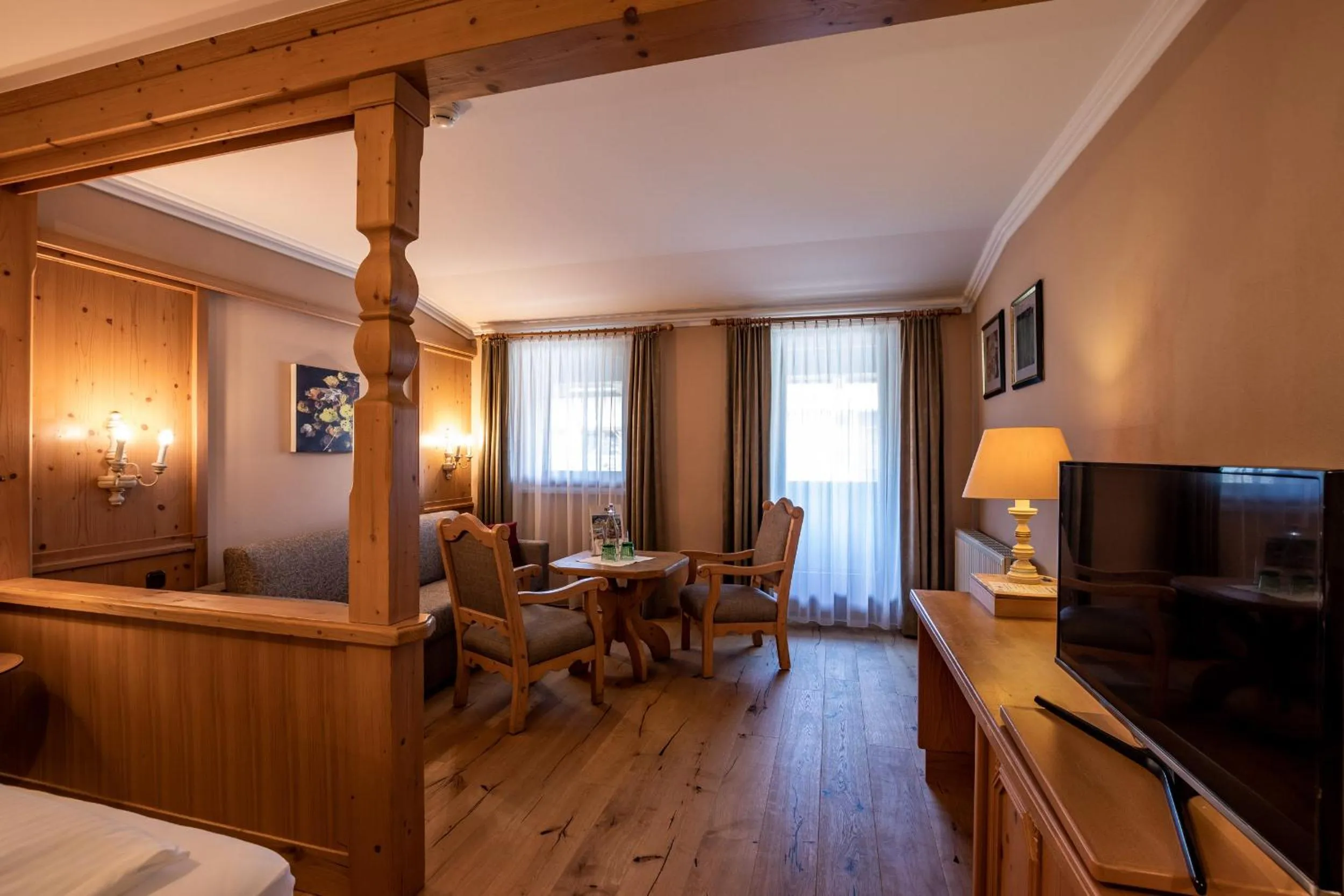 Seating area, Bed in Hotel Hochfilzer