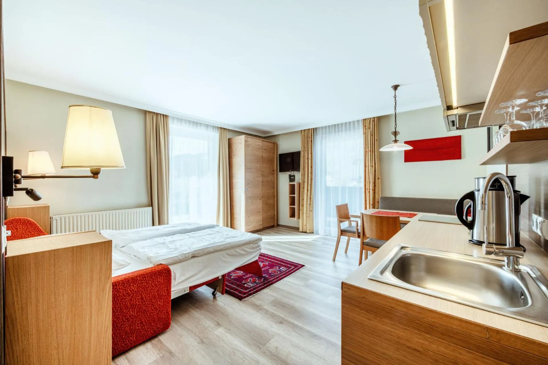 Kitchen or kitchenette, Bed in Harmls Aparthotel