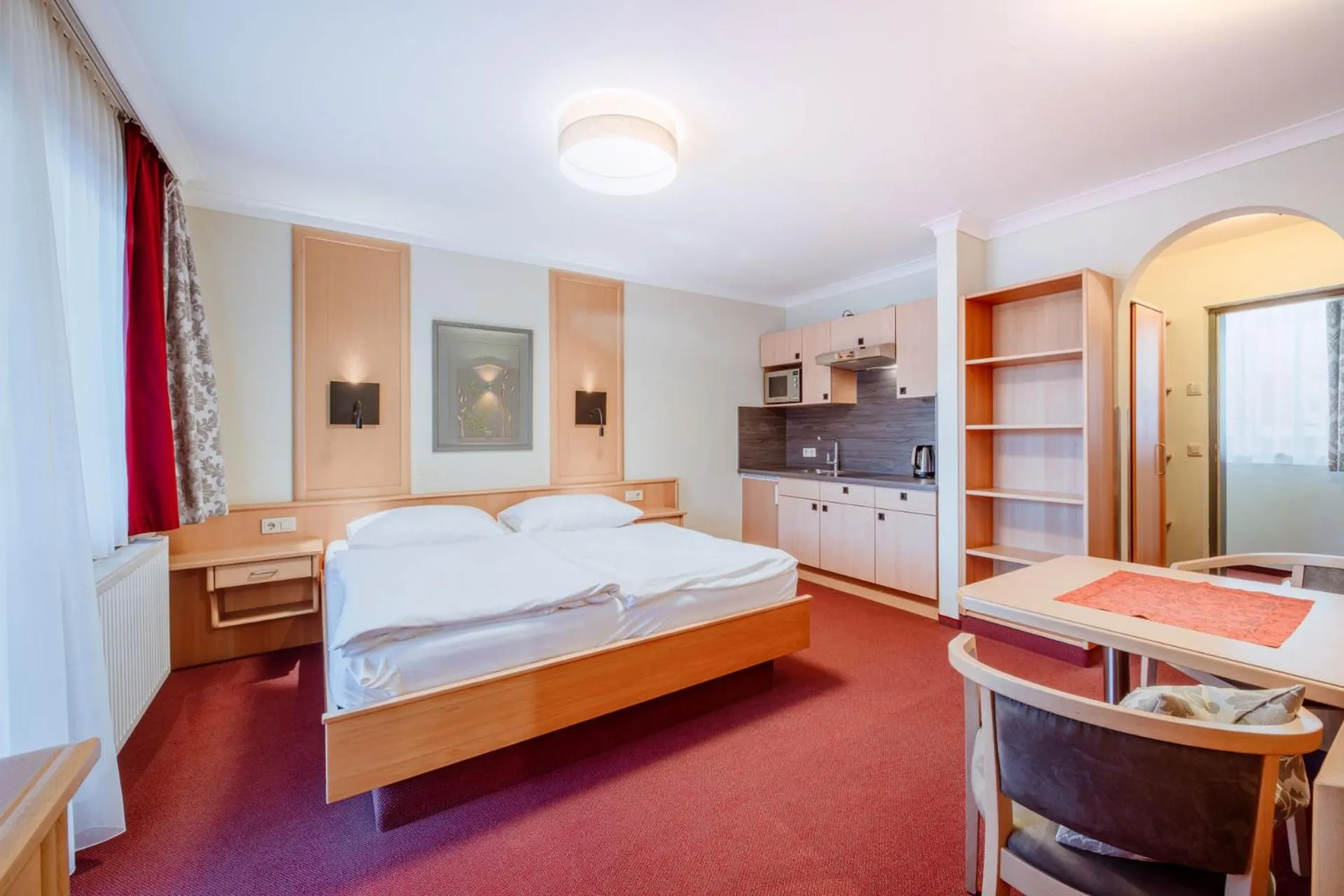 Dining area, Bed in Harmls Aparthotel