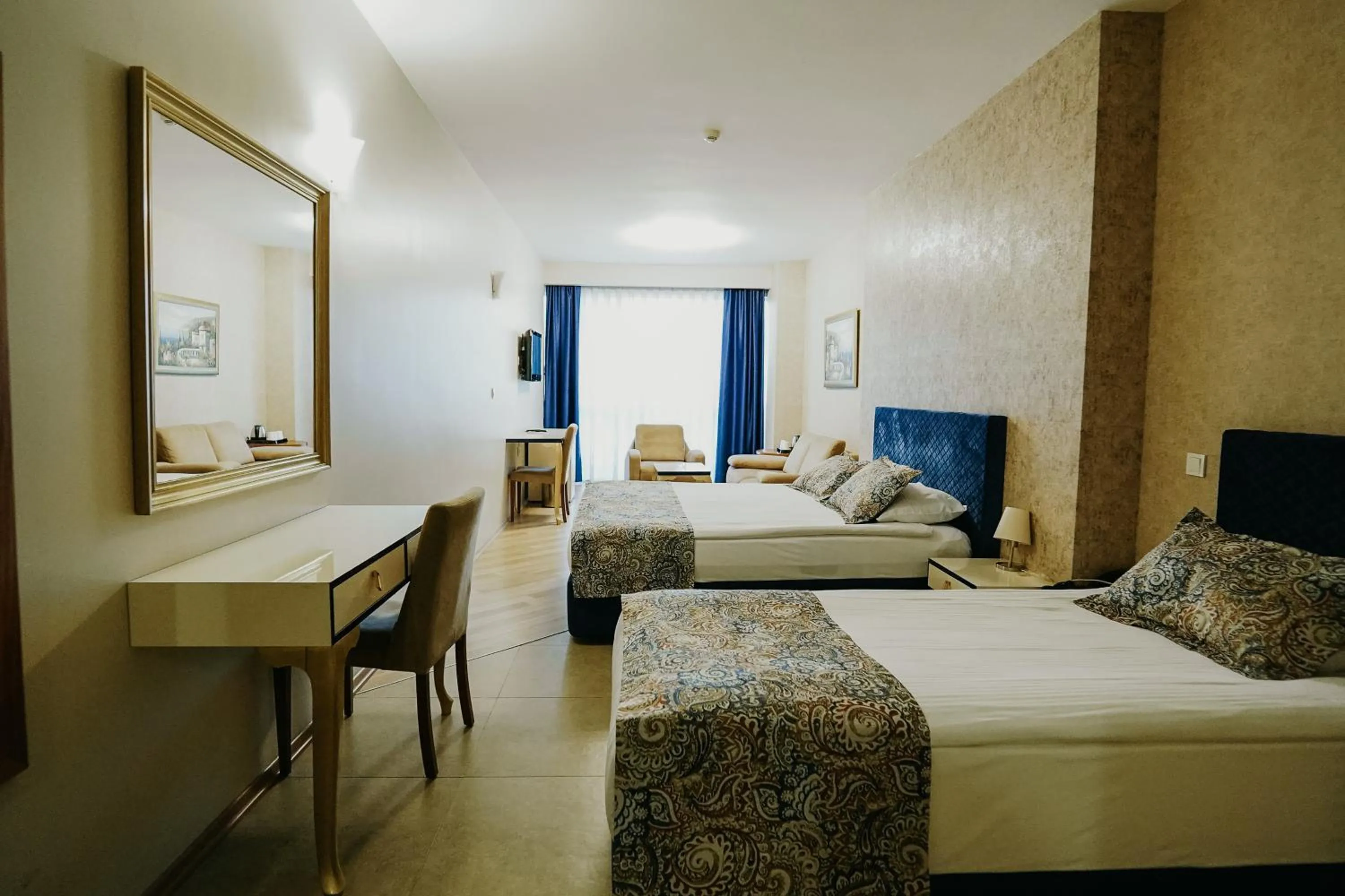 Communal lounge/ TV room, Bed in Grand Karot Hotel