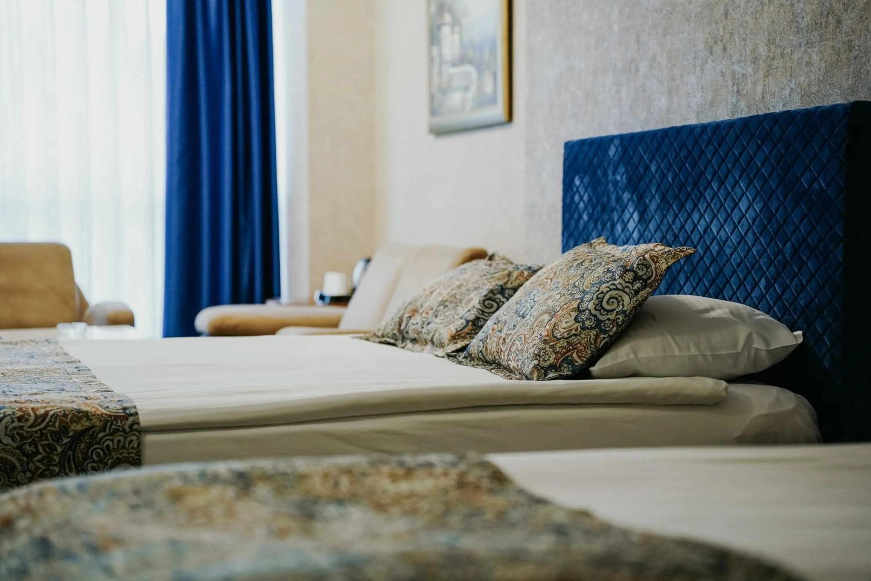 Communal lounge/ TV room, Bed in Grand Karot Hotel