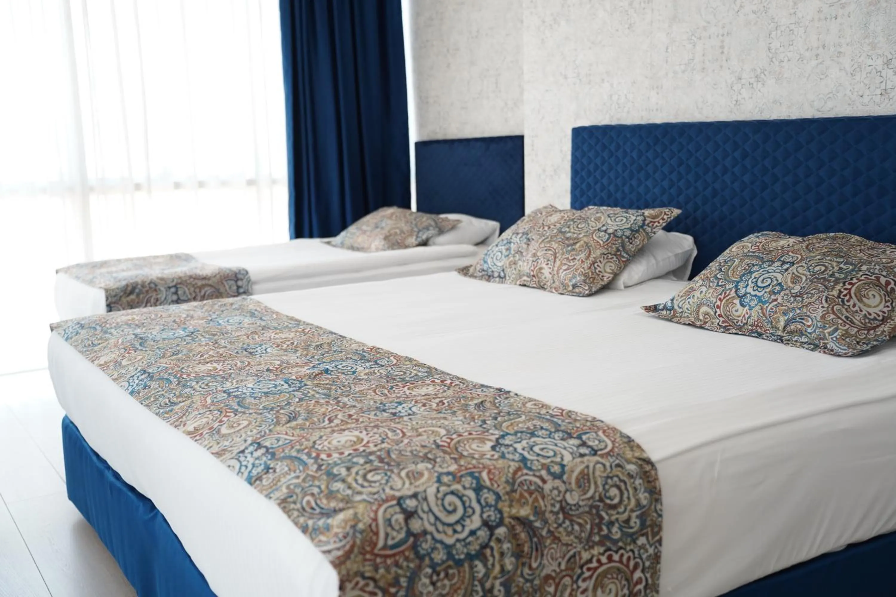 Communal lounge/ TV room, Bed in Grand Karot Hotel