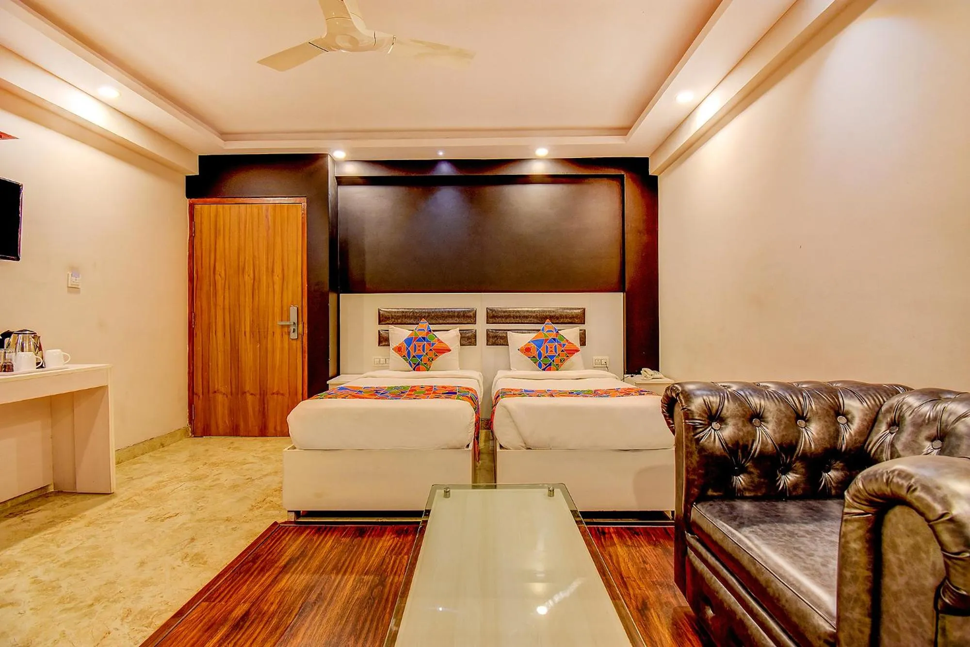 Living room, Bed in FabHotel Cozzy Inn - Tilak Nagar Main Road, Jayanagar