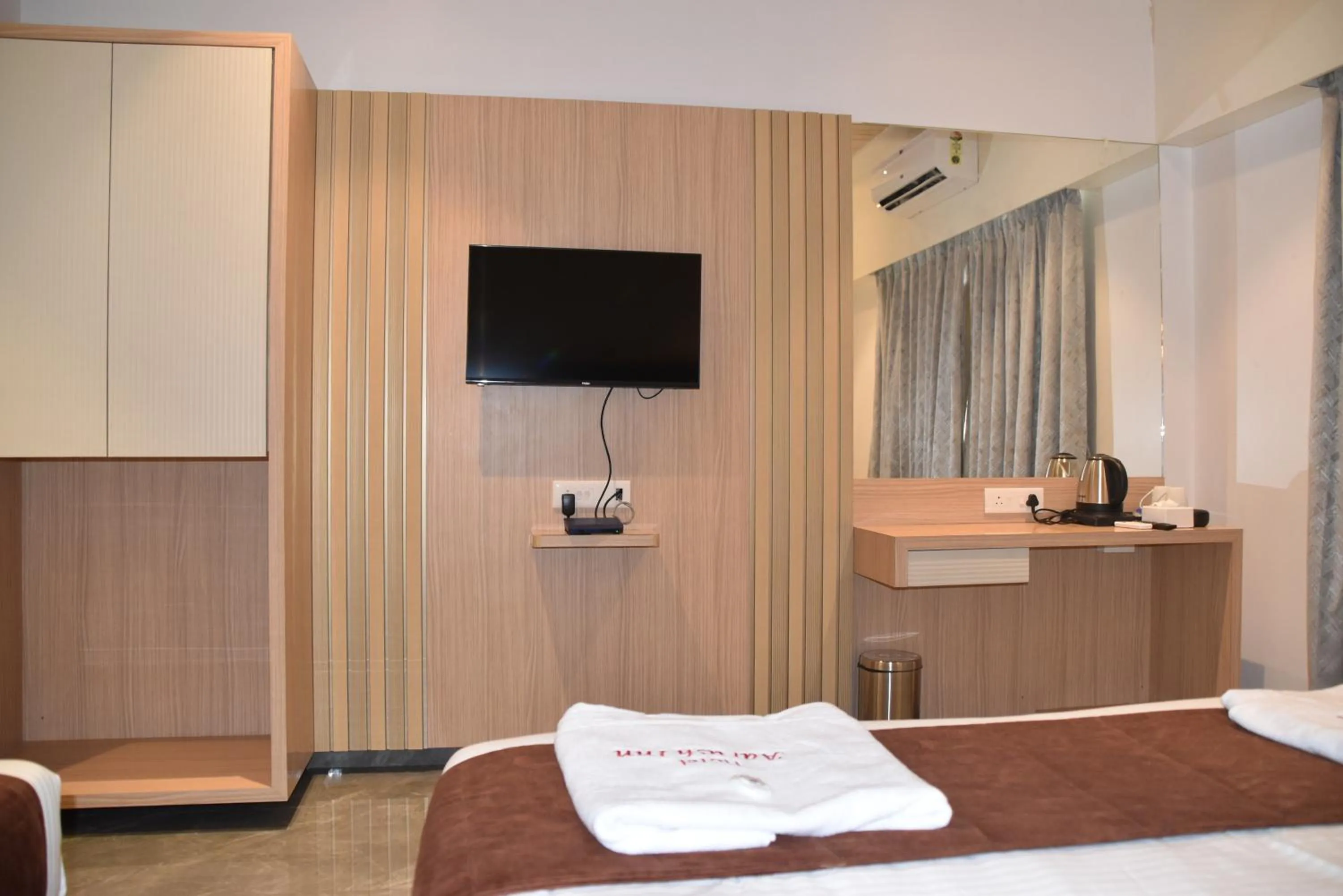 Bed in Hotel Aarush Inn