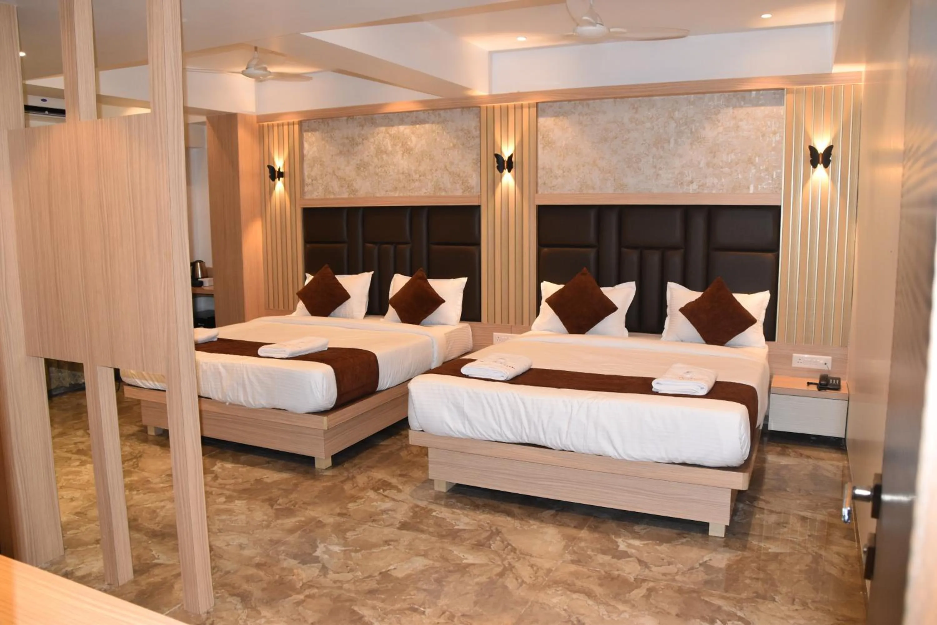 Bed in Hotel Aarush Inn