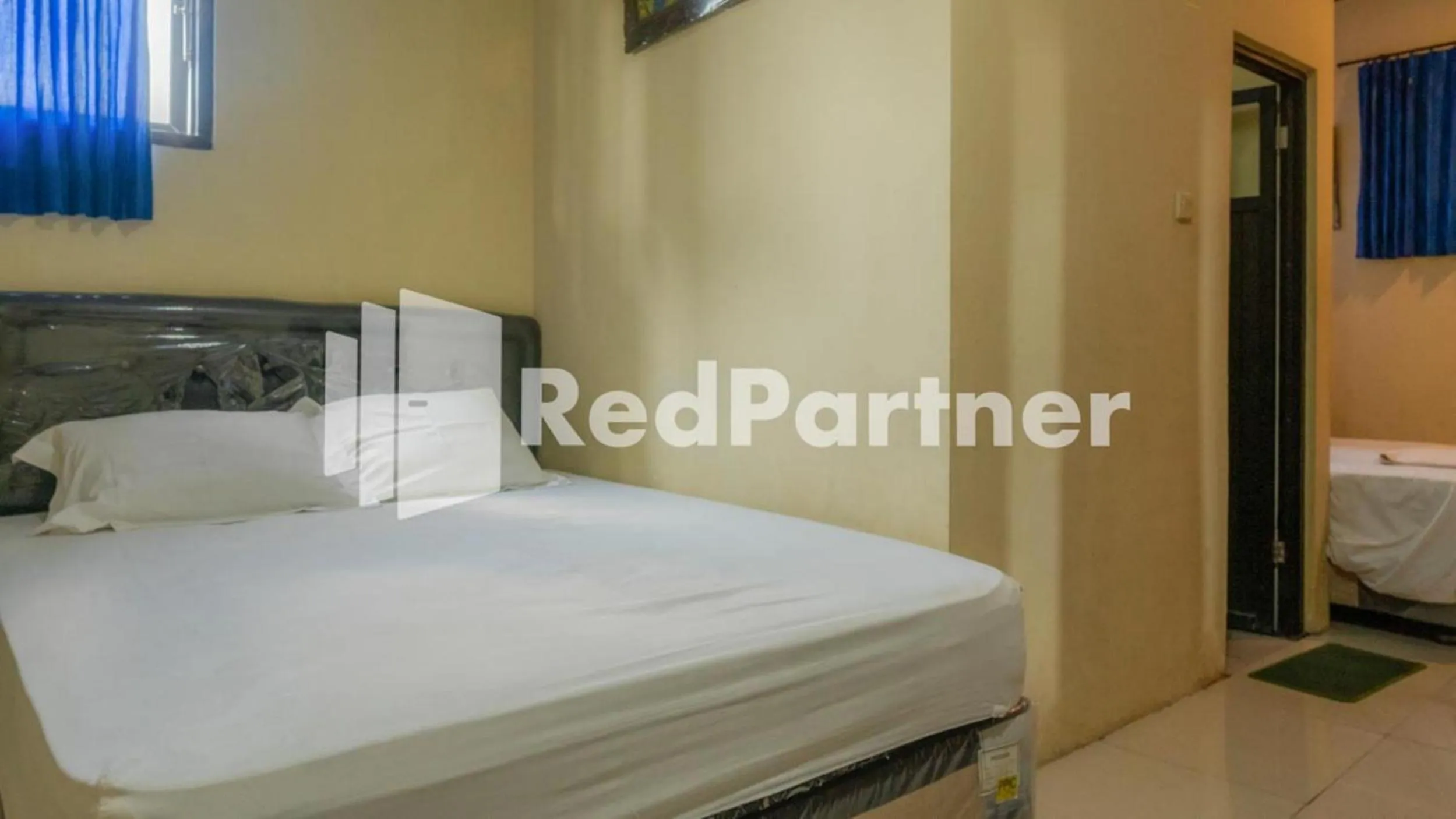Bed in Vandhela Homestay Syariah Mitra RedDoorz