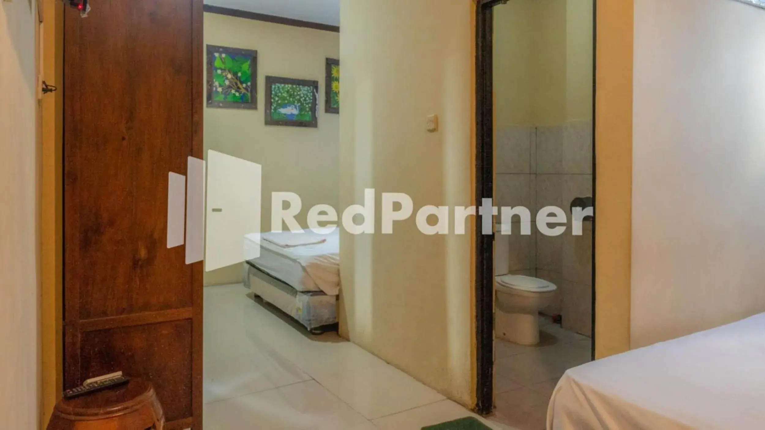 Bed in Vandhela Homestay Syariah Mitra RedDoorz Bed in Vandhela Homestay Syariah Mitra RedDoorz