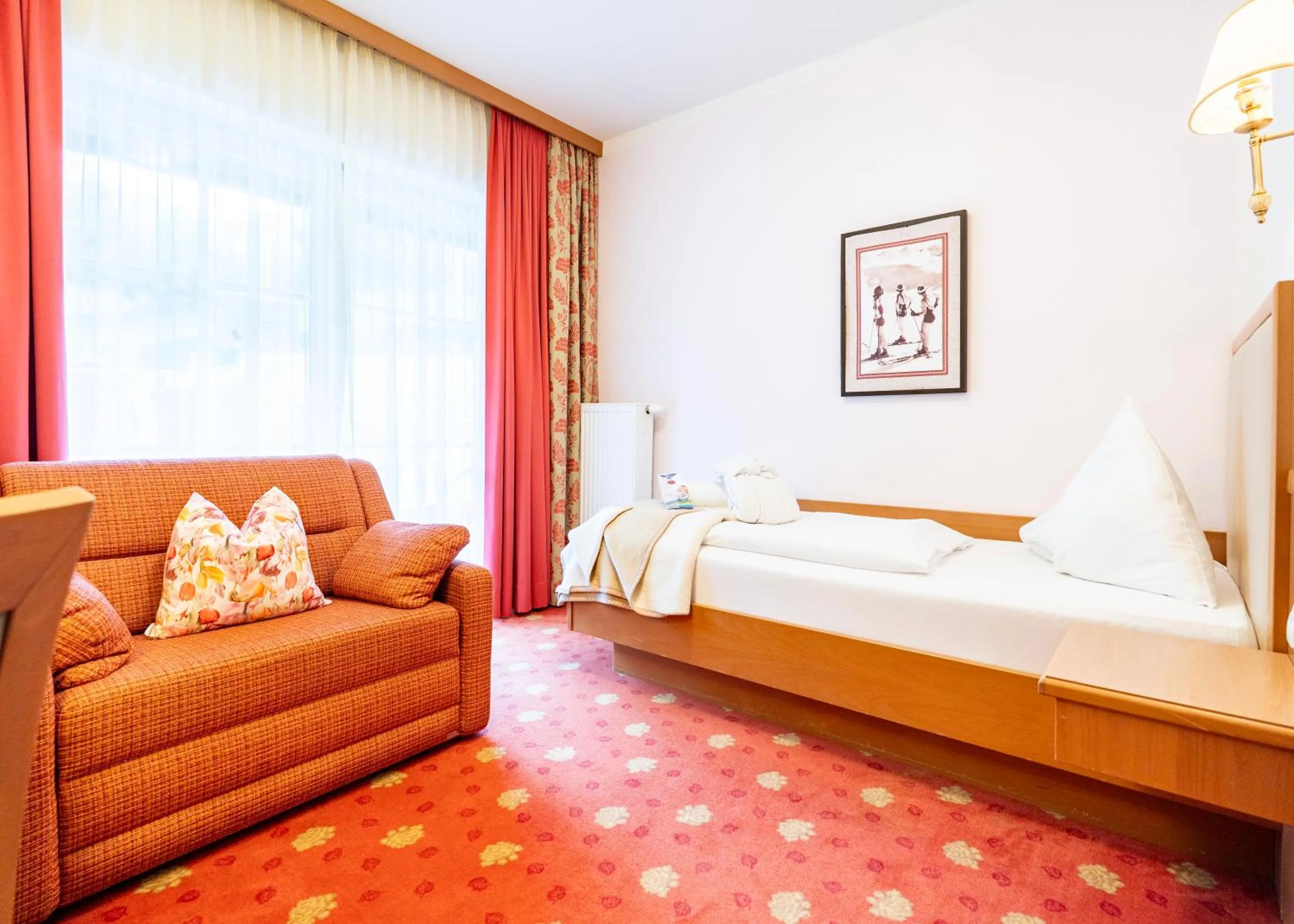 Seating area, Bed in Hotel Vitaler Landauerhof