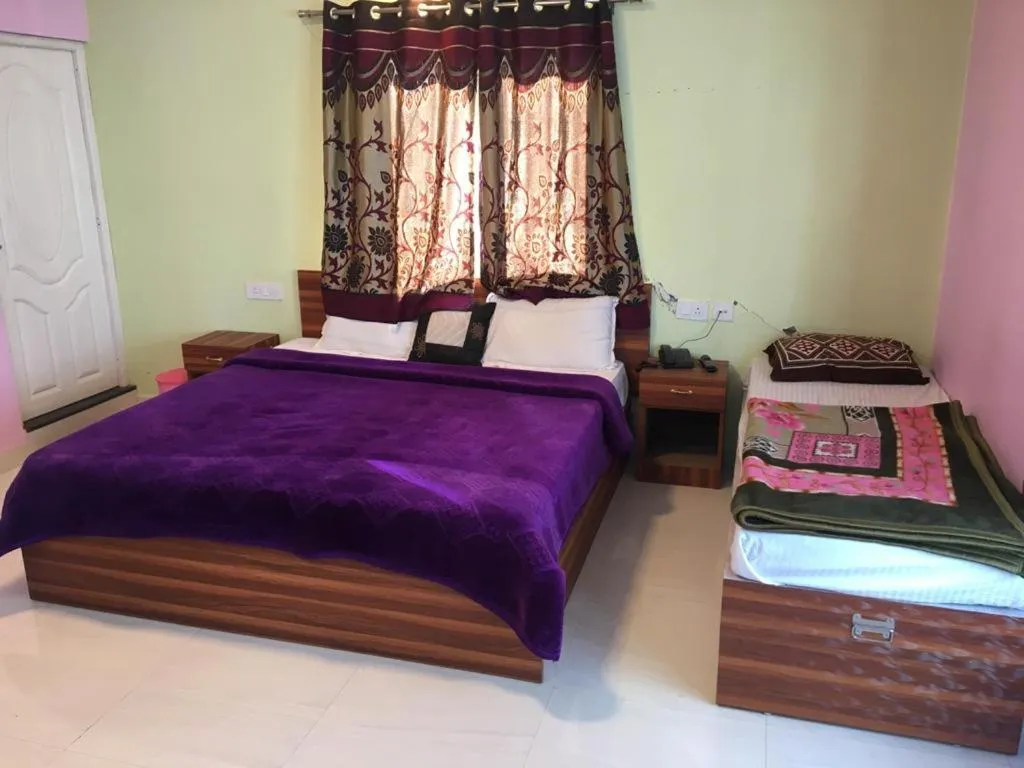 Bed in HAPPYSTAY rooms and cottages