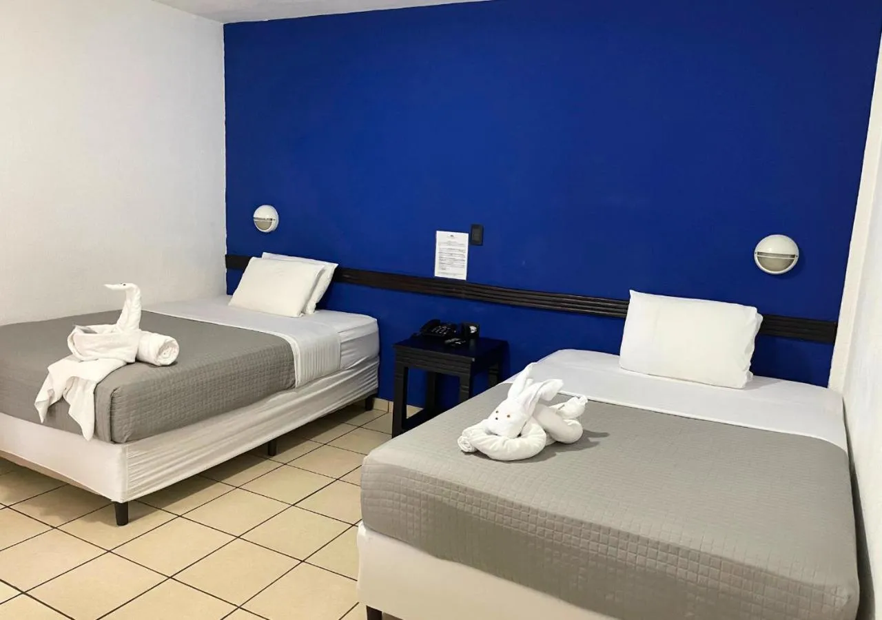 Bed in Las Veraneras Villas & Resort