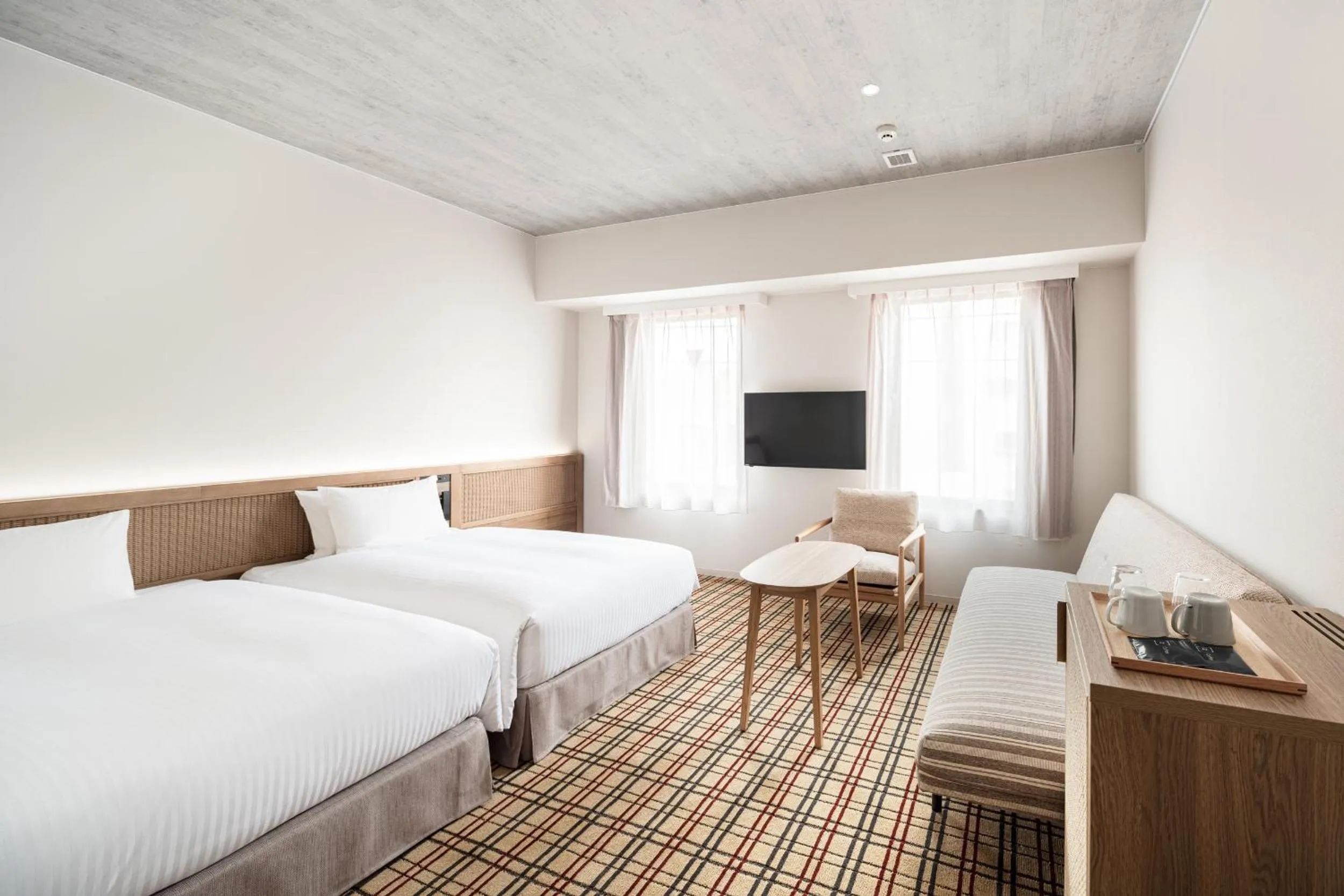 Photo of the whole room, Bed in Nest Hotel Naha Kumoji