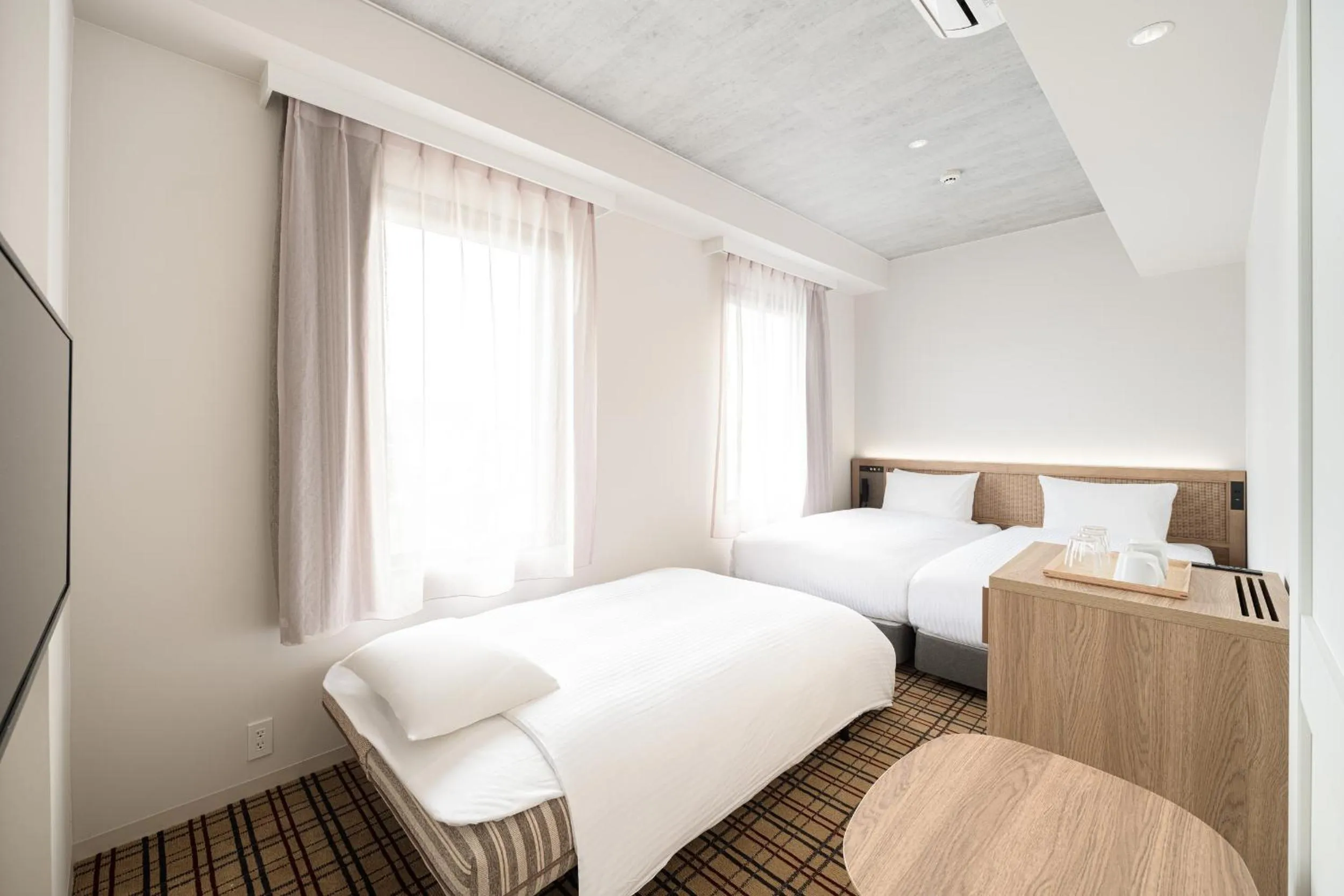 Photo of the whole room, Bed in Nest Hotel Naha Kumoji