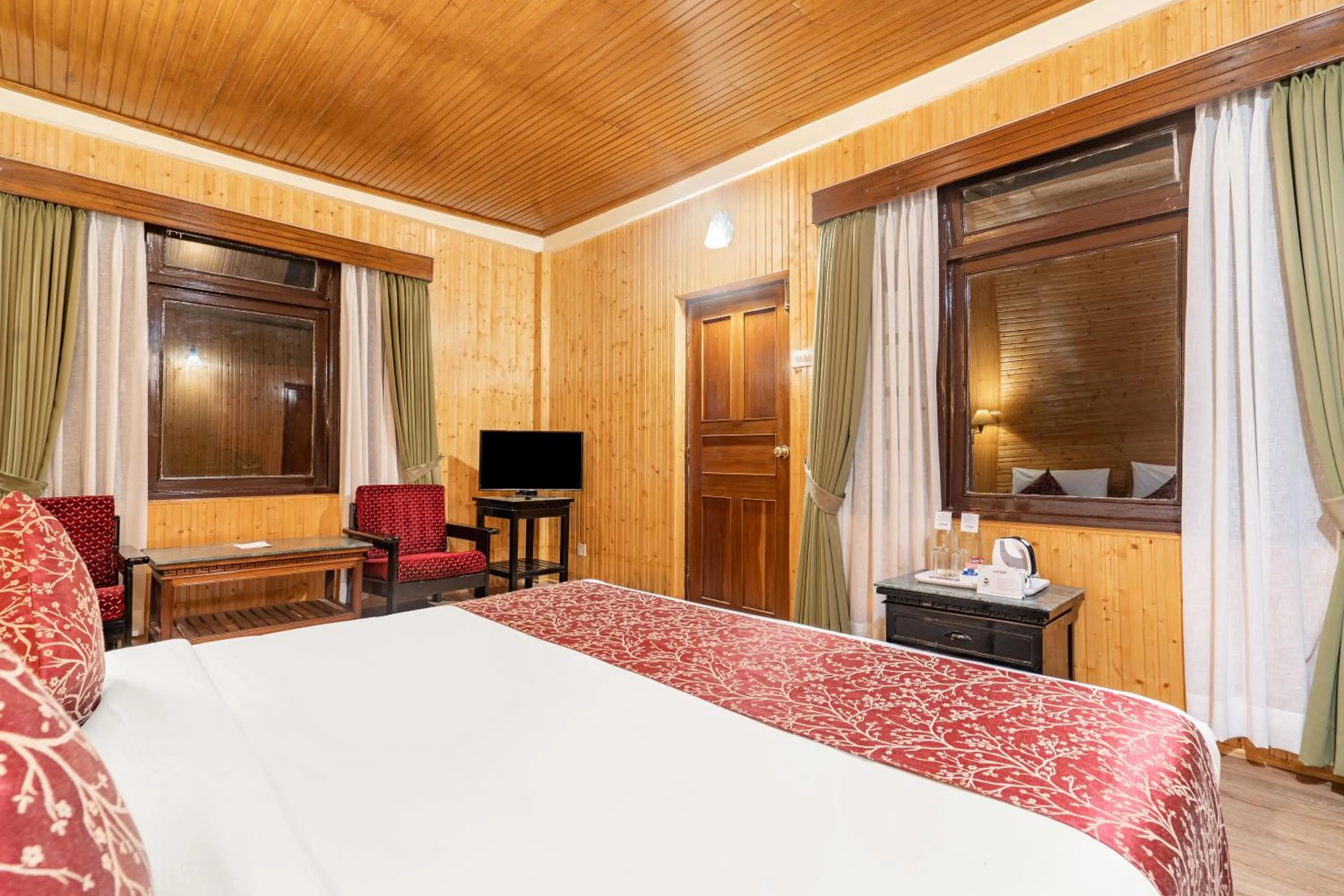 Seating area, Bed in Summit Tashi Ghang Heritage Resort