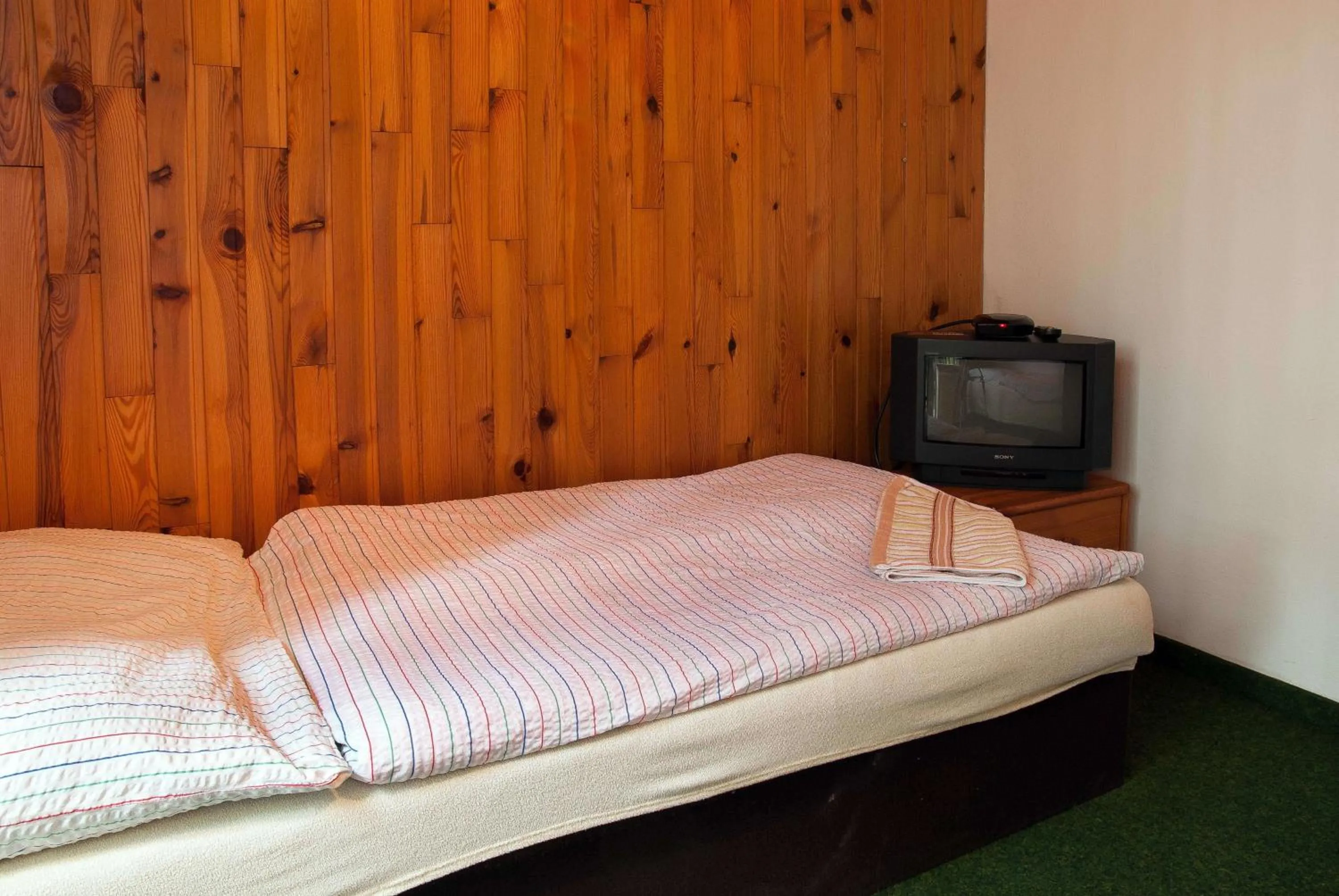 Bed in Lovecký hotel Jívák