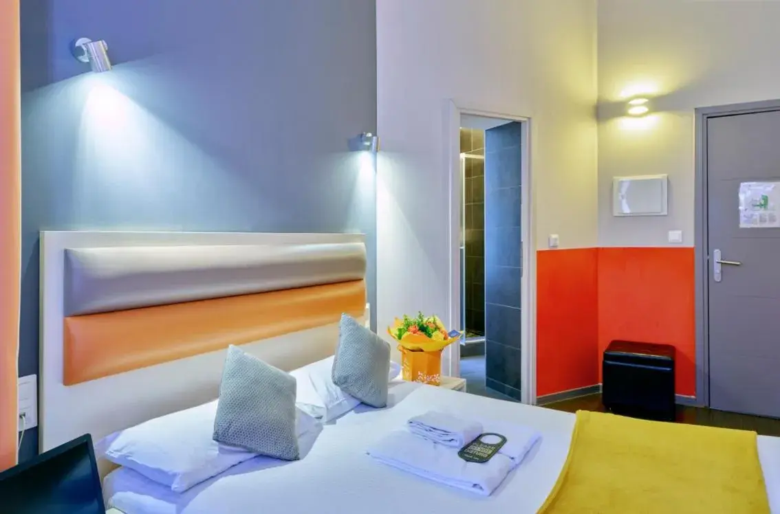 Bed in Adonis Hotel Strasbourg Bed in Adonis Hotel Strasbourg