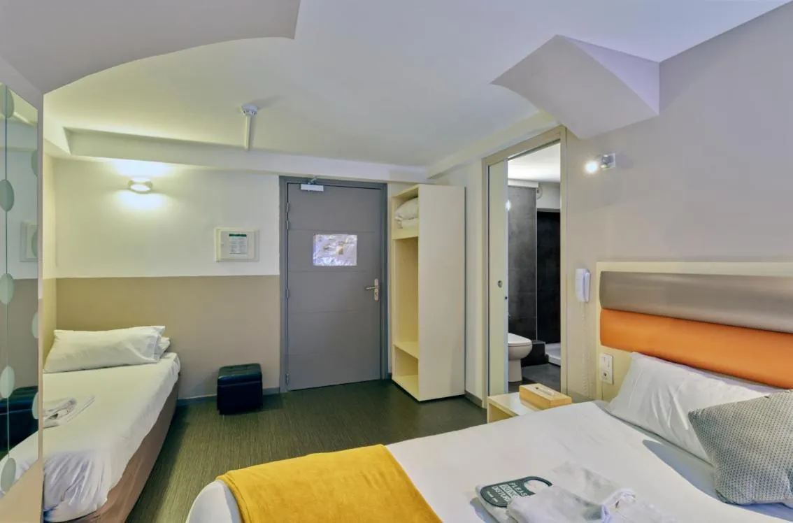 Bed in Adonis Hotel Strasbourg