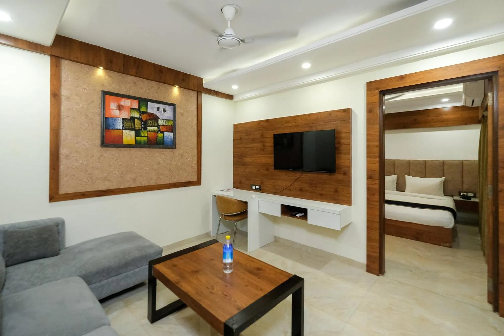 Living room, Bed in Hotel Golf Inn - Business-Friendly Stay near Golf Course Road, Cyberhub & Metro