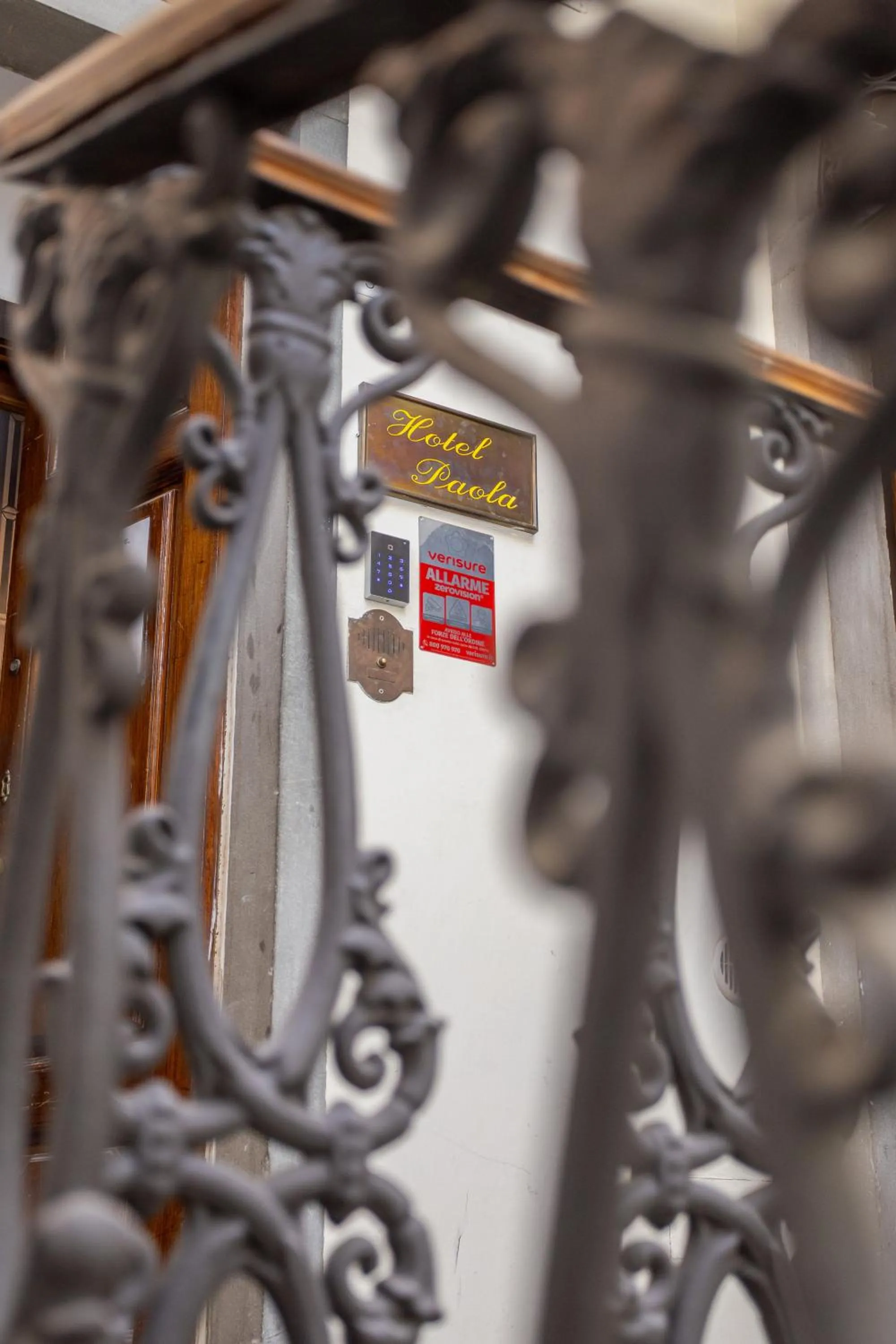 Property logo or sign in Hotel Paola