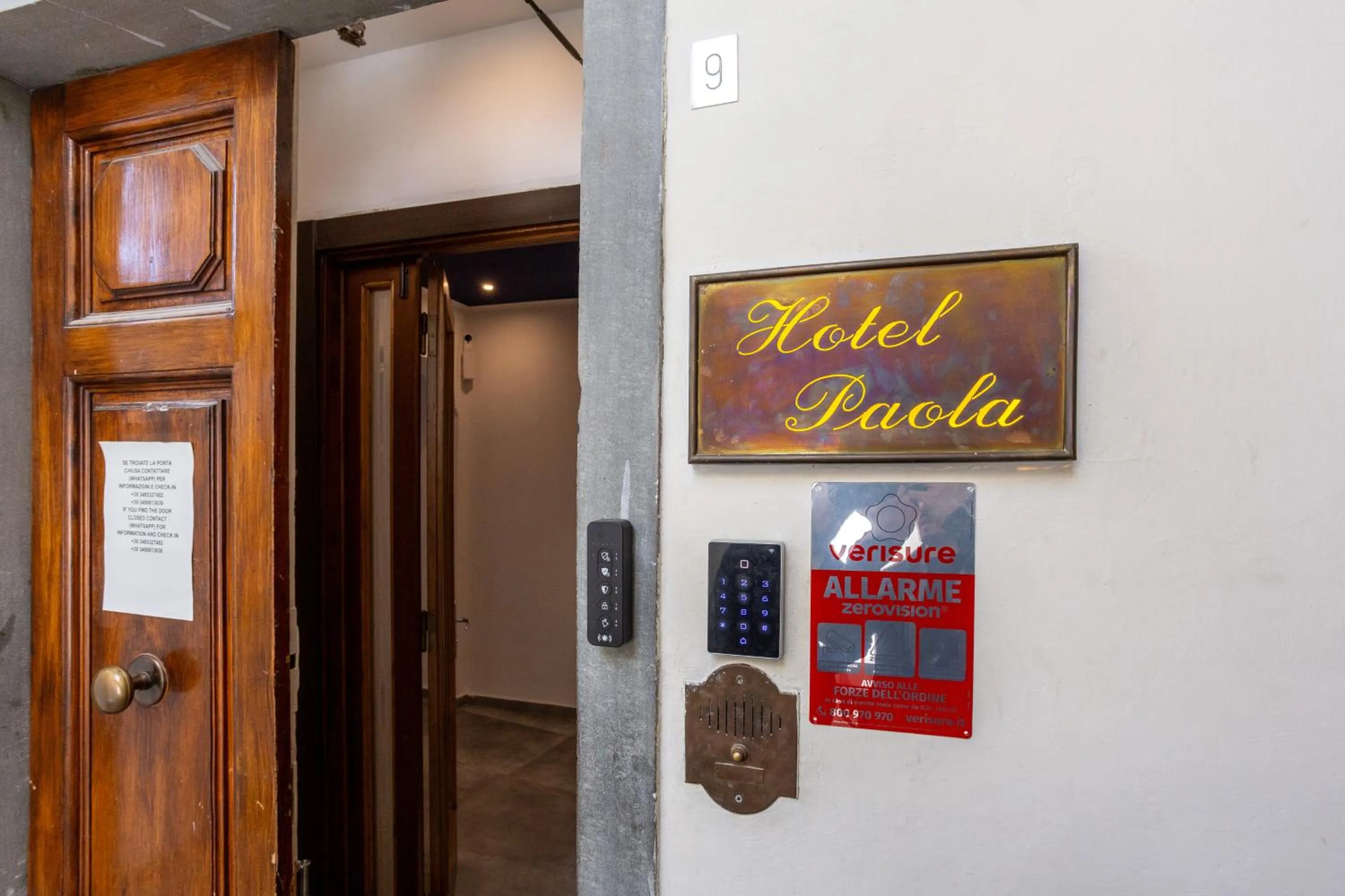 Property logo or sign in Hotel Paola