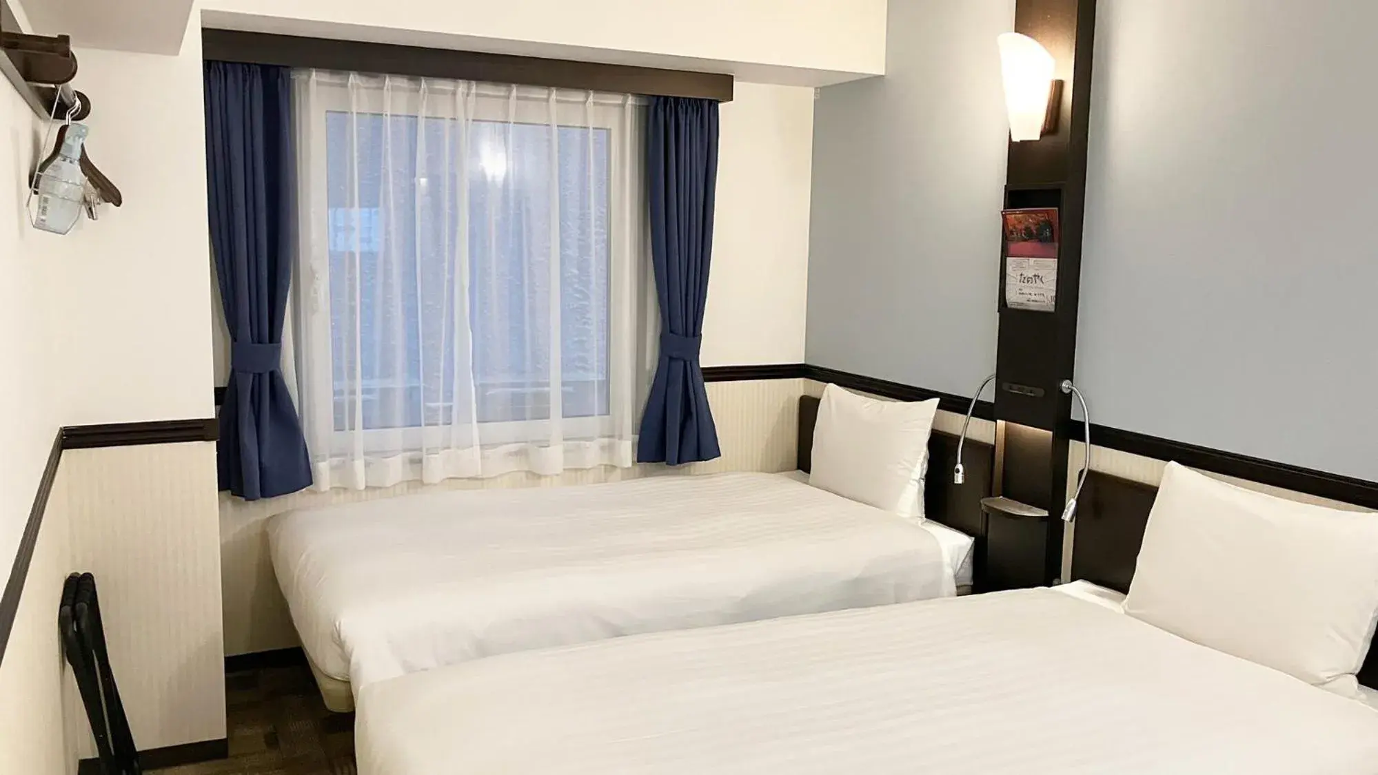 Bed in Toyoko Inn Tokyo Hachioji-eki Kita-guchi Bed in Toyoko Inn Tokyo Hachioji-eki Kita-guchi