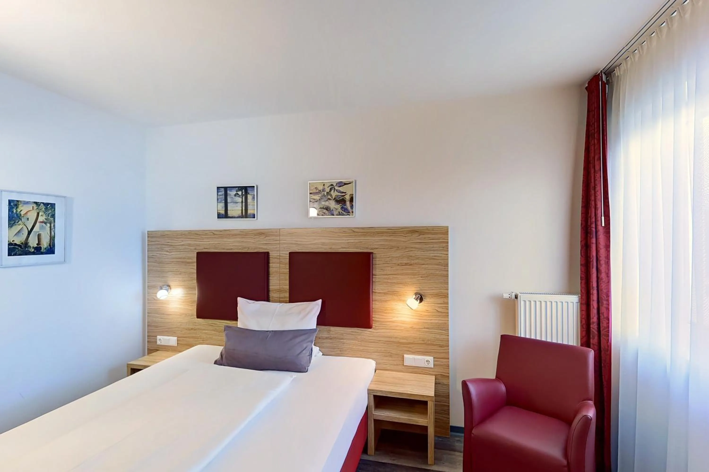 Bed in SmartMotel Emden - by Quartier96 GmbH