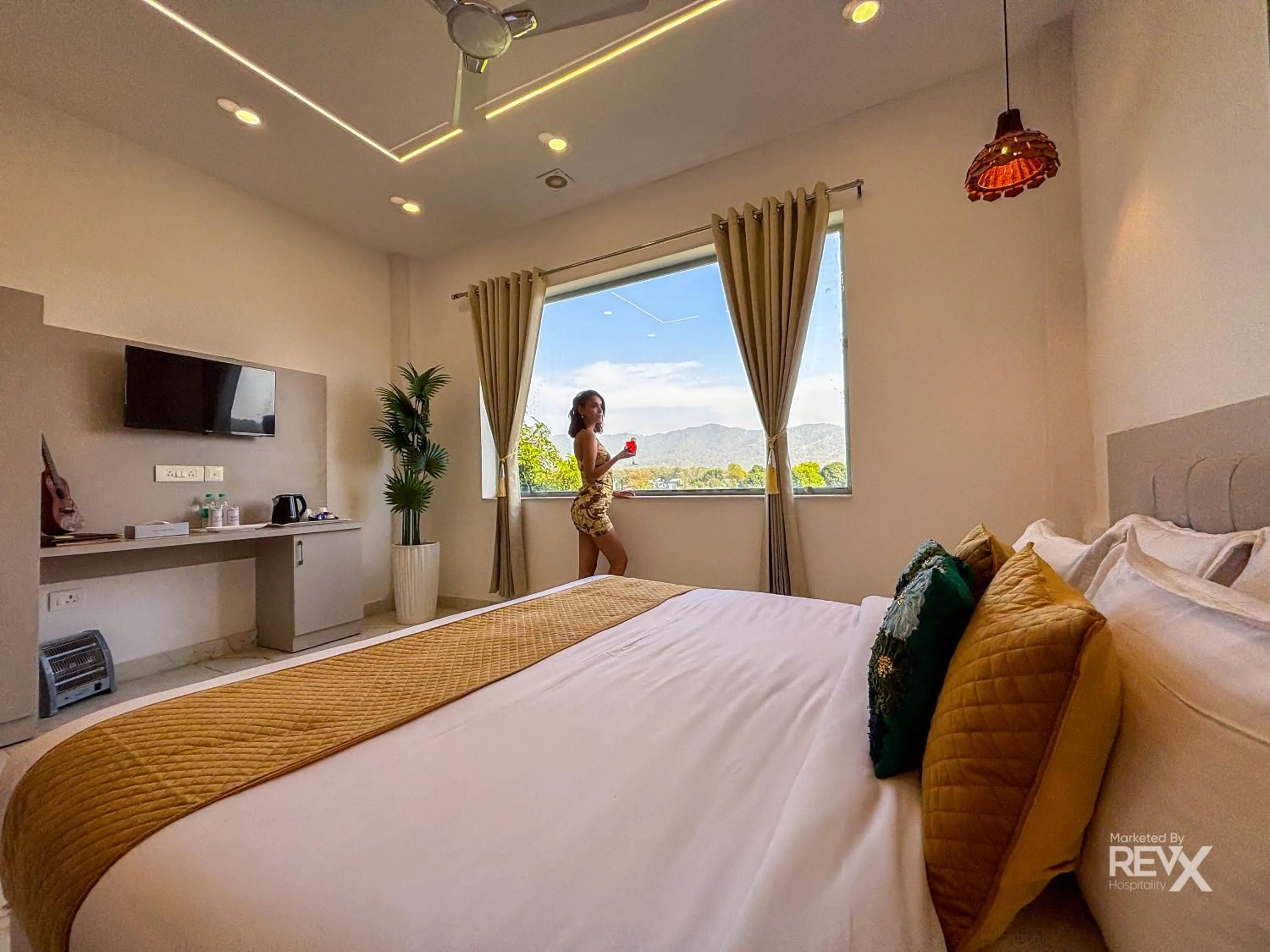 Bed in The Neeraj River Forest Resort Ayurvedic Wellness Center