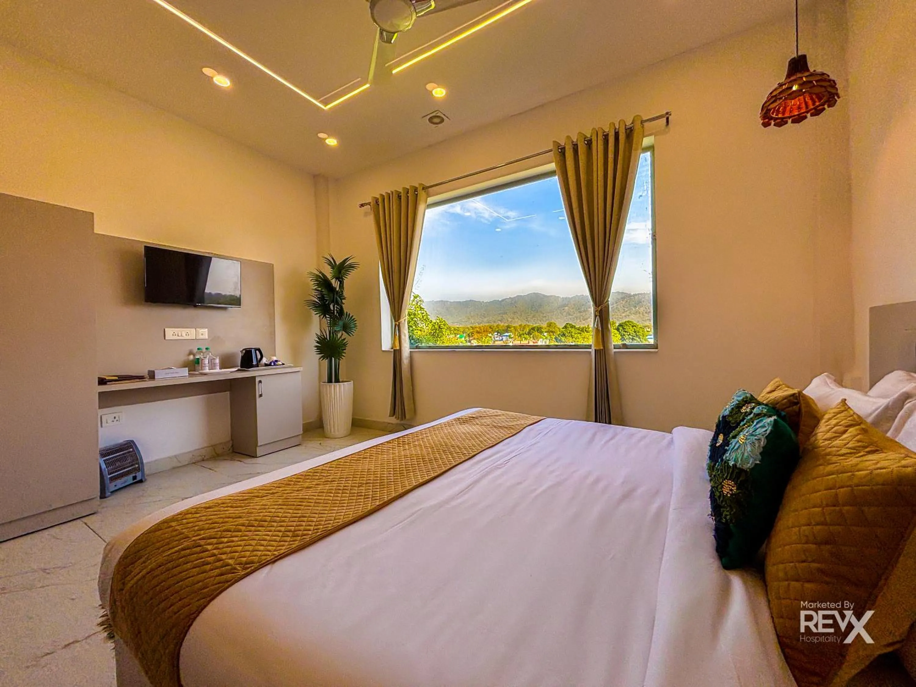 Bed in The Neeraj River Forest Resort Ayurvedic Wellness Center