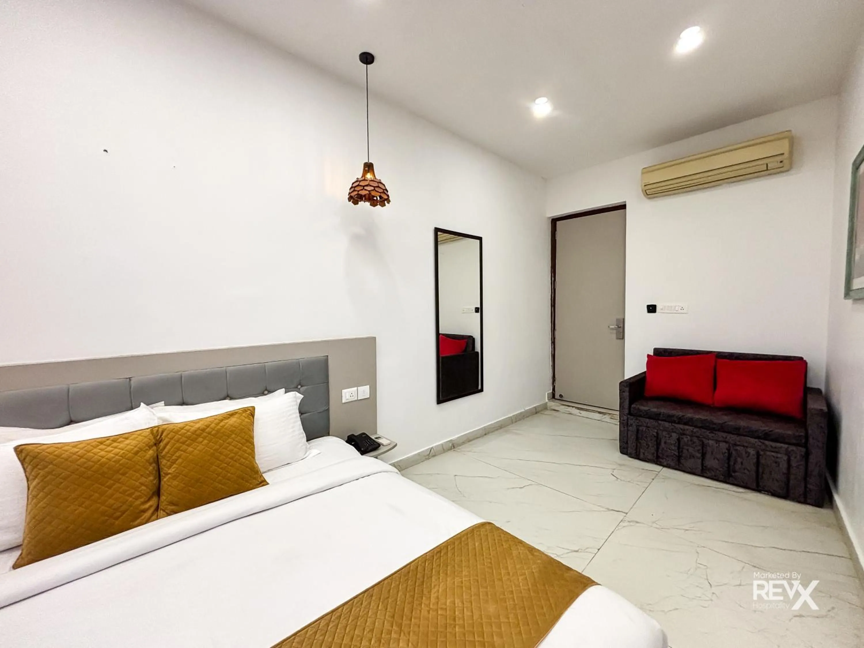 Bed in The Neeraj River Forest Resort Ayurvedic Wellness Center