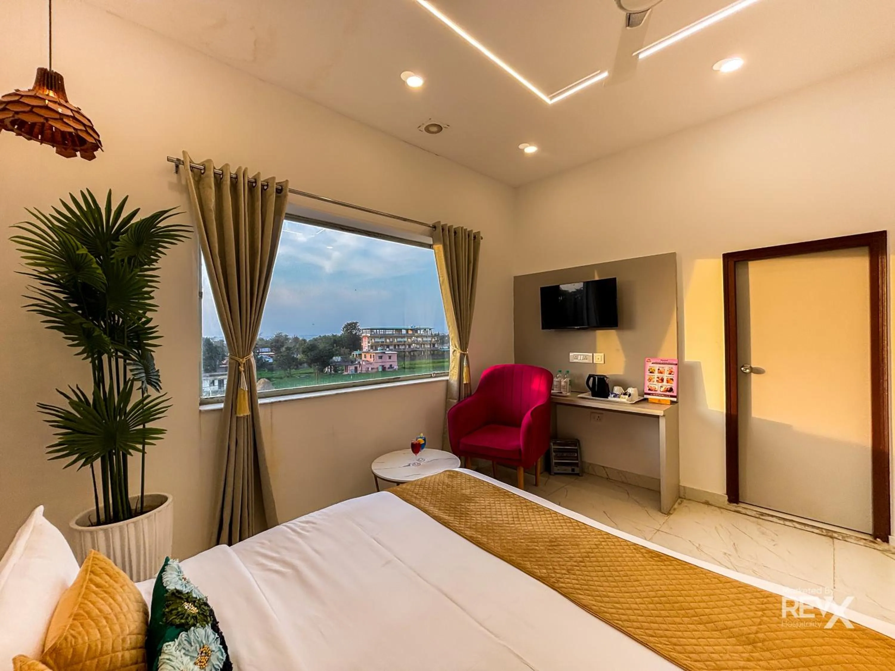 Bed in The Neeraj River Forest Resort Ayurvedic Wellness Center