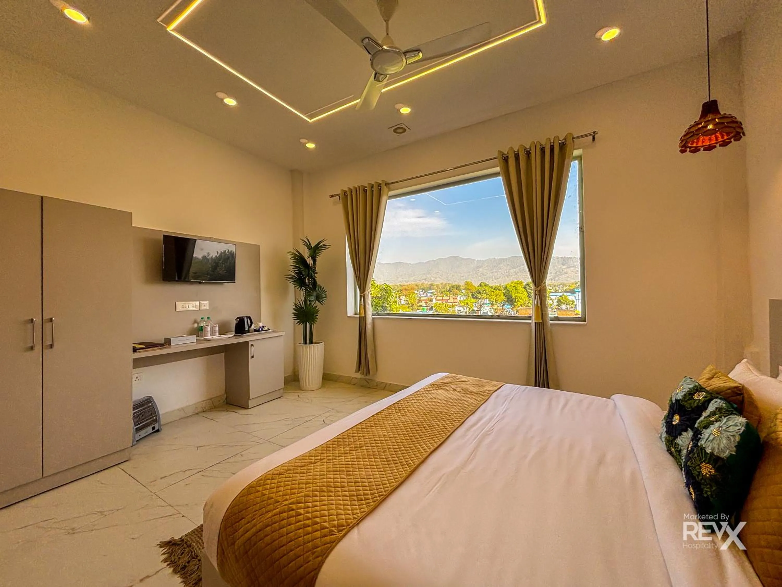 Bed in The Neeraj River Forest Resort Ayurvedic Wellness Center