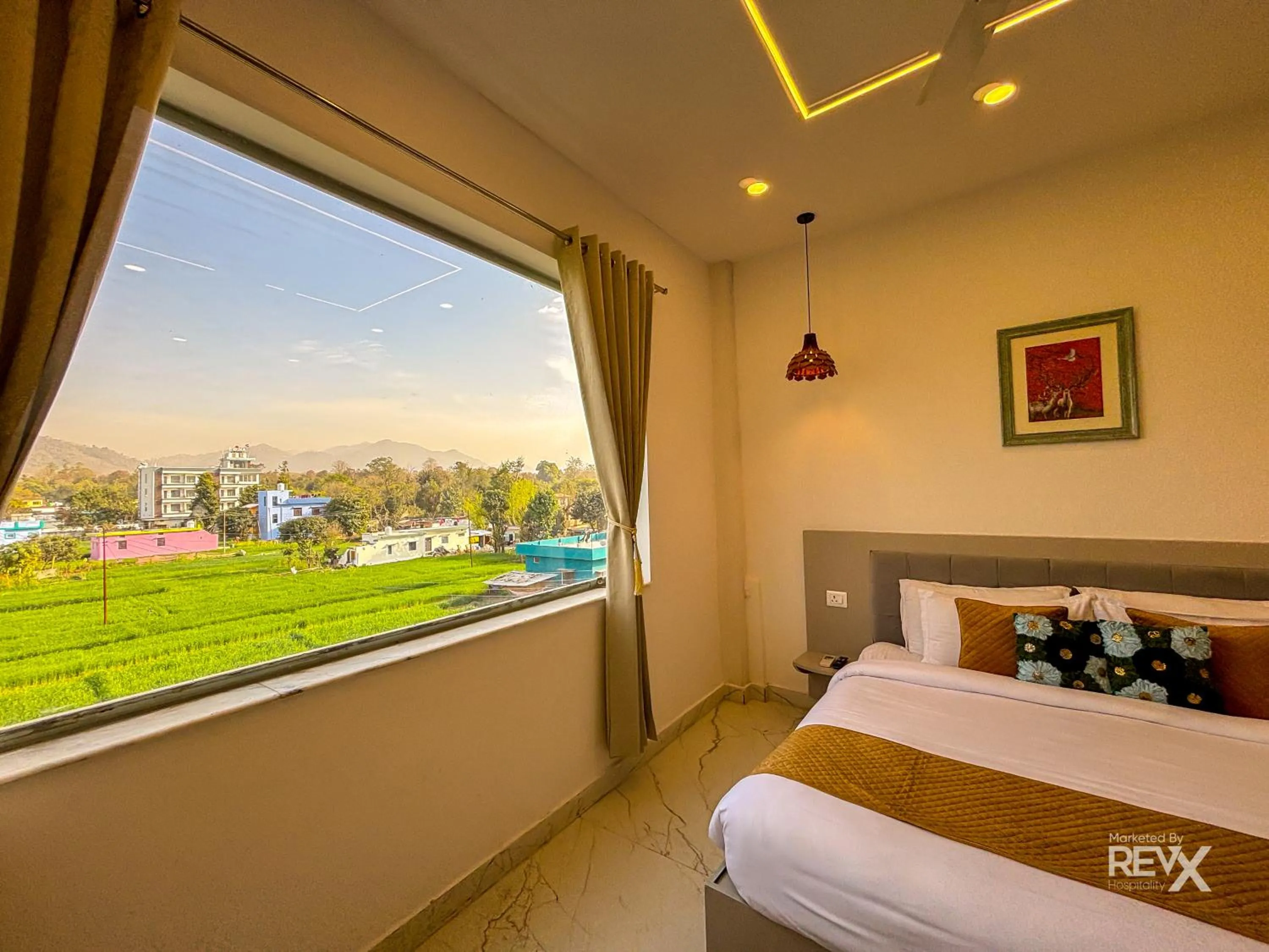 Bed in The Neeraj River Forest Resort Ayurvedic Wellness Center