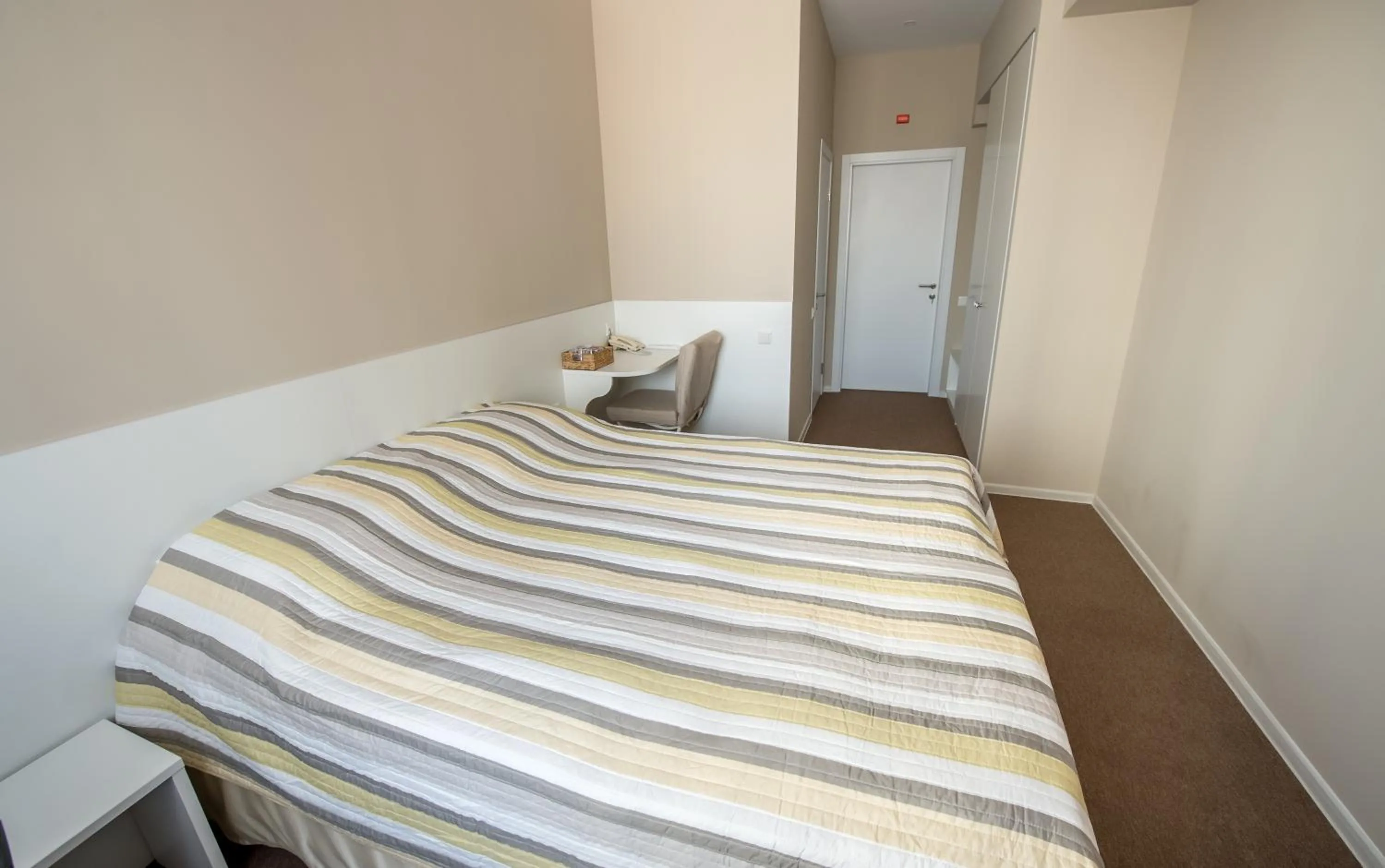 Photo of the whole room, Bed in light hotel & hub