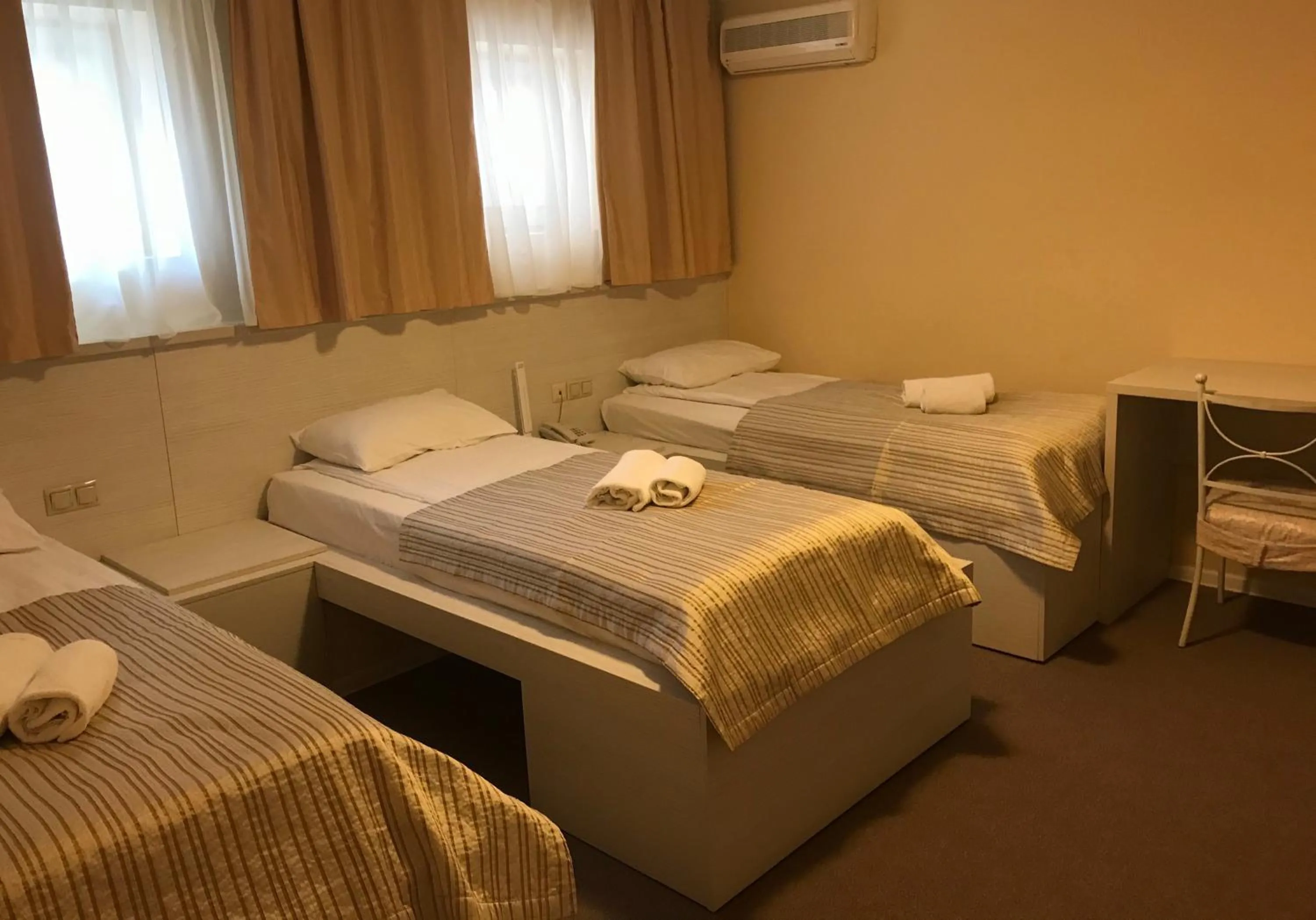 Photo of the whole room, Bed in light hotel & hub