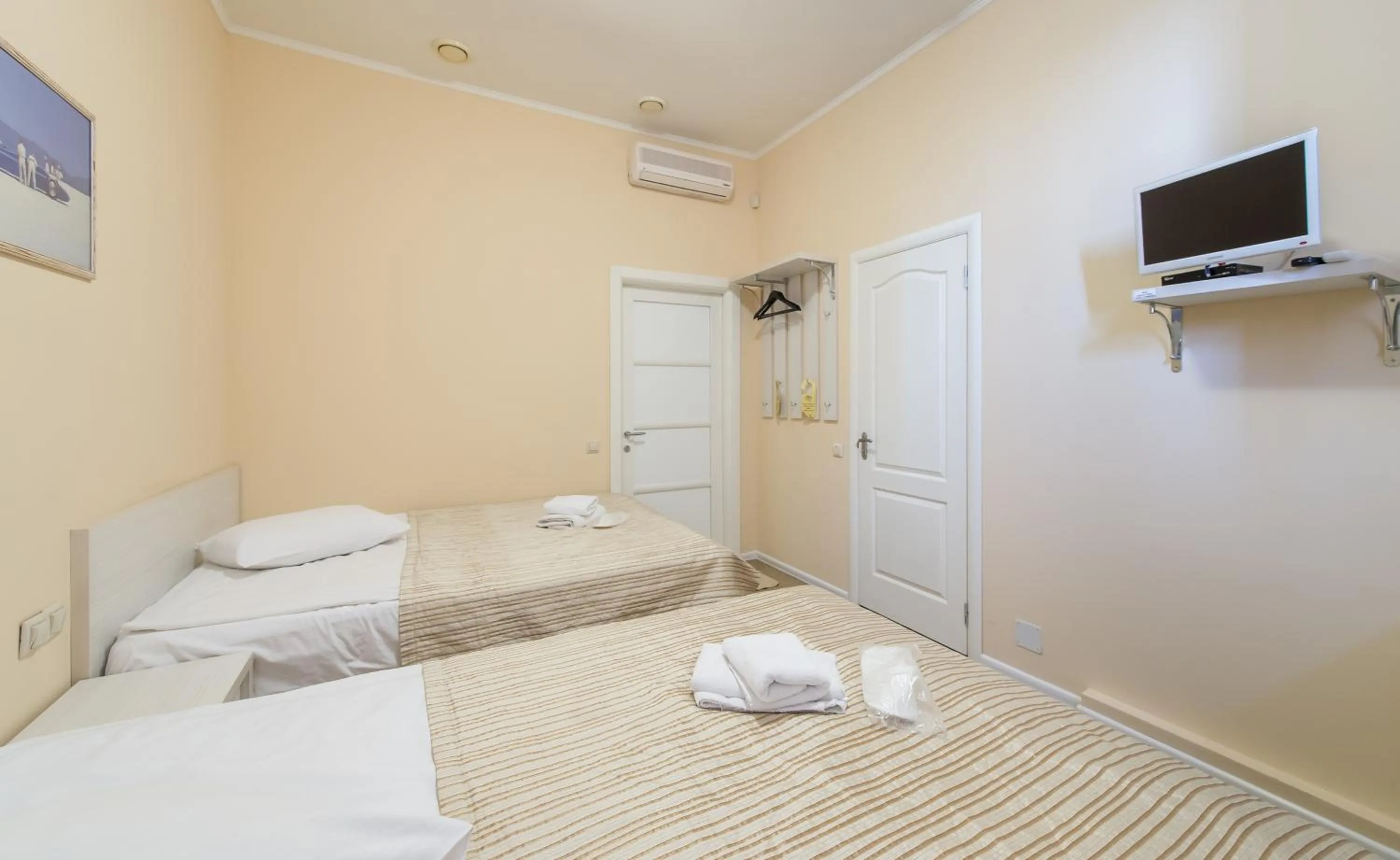 Bathroom, Bed in light hotel & hub