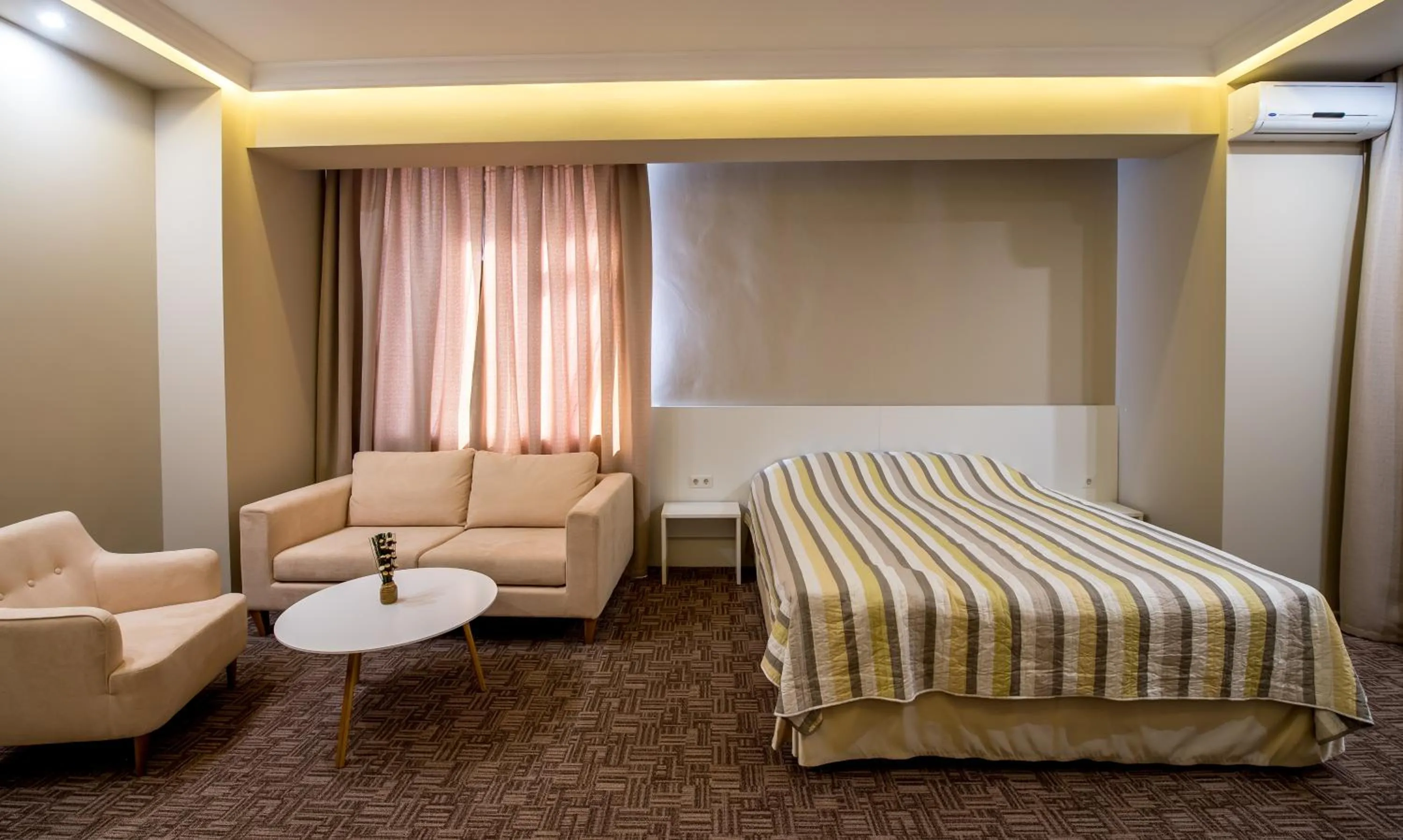 Photo of the whole room, Bed in light hotel & hub