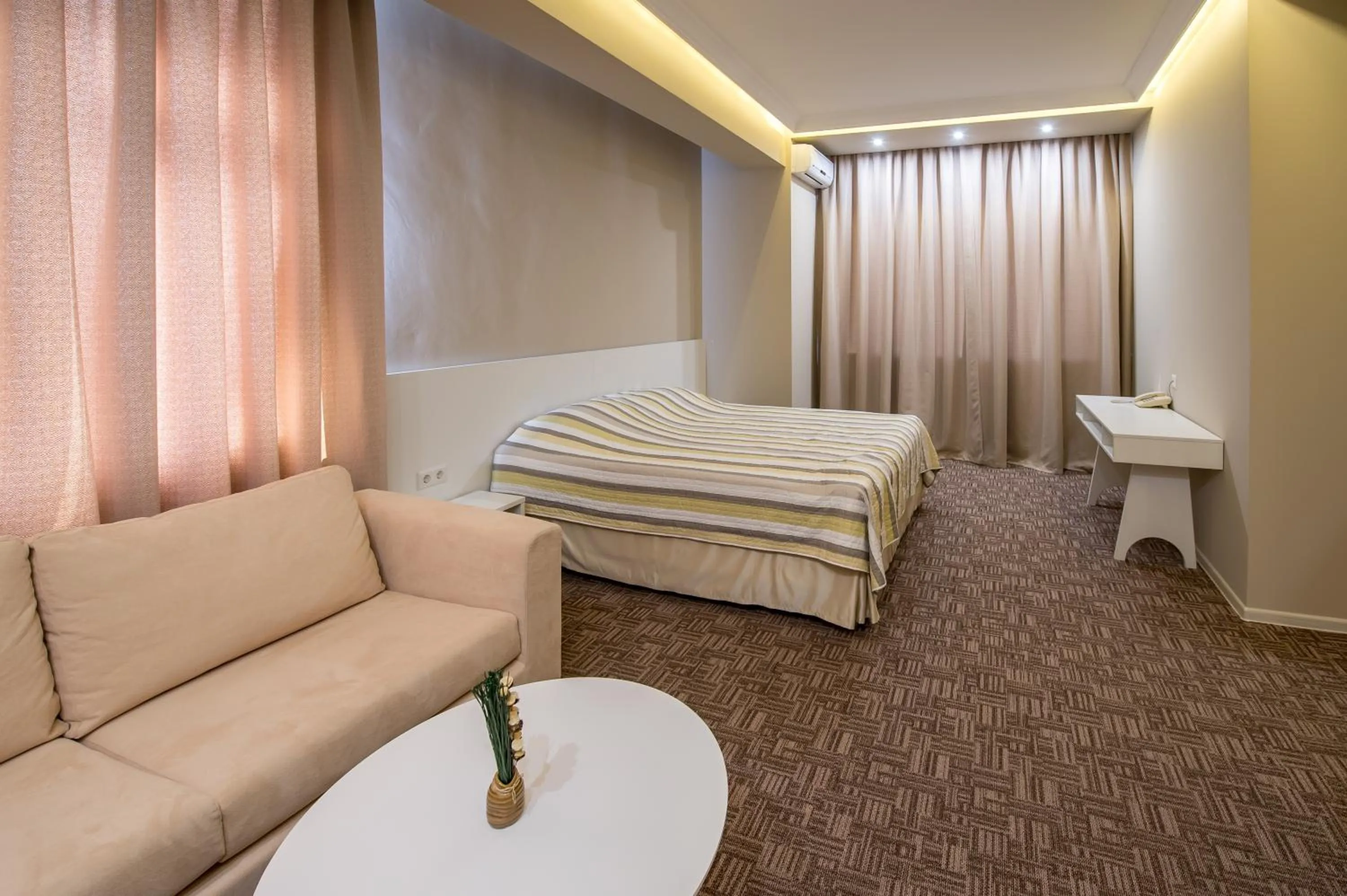 Photo of the whole room, Bed in light hotel & hub
